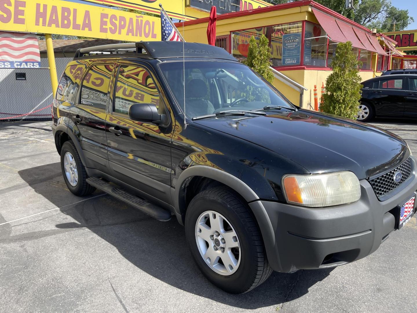 2003 Ebony /Gray Cloth Ford Escape XLT 4WD (1FMYU93123K) with an 3.0L V6 engine, Automatic transmission, located at 801 South State Street, Salt Lake City, UT, 84111, (801) 328-0098, 40.751953, -111.888206 - Clean Title!! Extra clean!! Immaculate condition!! Free Carfax!! Must see!! Warranty available!! Free Carfax!!! Vehicle Features: XLT Model, 4WD/AWD, ABS Brakes, Air Conditioning, Alloy Wheels, AM/FM Stereo, Automatic Transmission, CD Audio, Cloth Seats, Cruise Control, Full Roof Rack, Power Lo - Photo#3