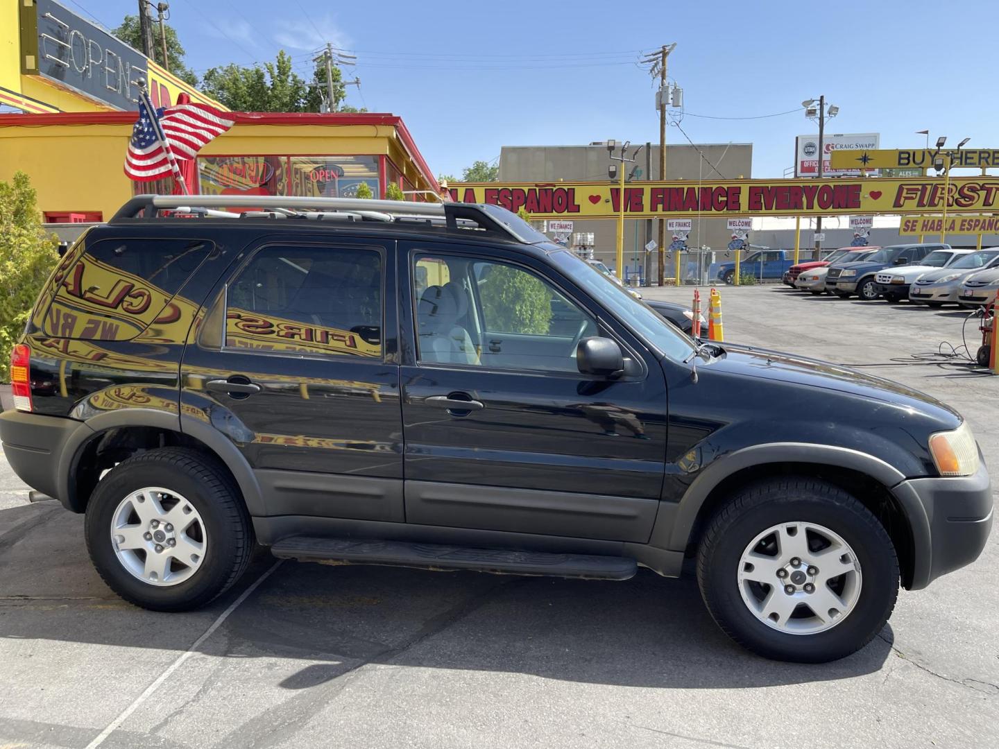 2003 Ebony /Gray Cloth Ford Escape XLT 4WD (1FMYU93123K) with an 3.0L V6 engine, Automatic transmission, located at 801 South State Street, Salt Lake City, UT, 84111, (801) 328-0098, 40.751953, -111.888206 - Clean Title!! Extra clean!! Immaculate condition!! Free Carfax!! Must see!! Warranty available!! Free Carfax!!! Vehicle Features: XLT Model, 4WD/AWD, ABS Brakes, Air Conditioning, Alloy Wheels, AM/FM Stereo, Automatic Transmission, CD Audio, Cloth Seats, Cruise Control, Full Roof Rack, Power Lo - Photo#4