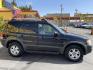 2003 Ebony /Gray Cloth Ford Escape XLT 4WD (1FMYU93123K) with an 3.0L V6 engine, Automatic transmission, located at 801 South State Street, Salt Lake City, UT, 84111, (801) 328-0098, 40.751953, -111.888206 - Clean Title!! Extra clean!! Immaculate condition!! Free Carfax!! Must see!! Warranty available!! Free Carfax!!! Vehicle Features: XLT Model, 4WD/AWD, ABS Brakes, Air Conditioning, Alloy Wheels, AM/FM Stereo, Automatic Transmission, CD Audio, Cloth Seats, Cruise Control, Full Roof Rack, Power Lo - Photo#4
