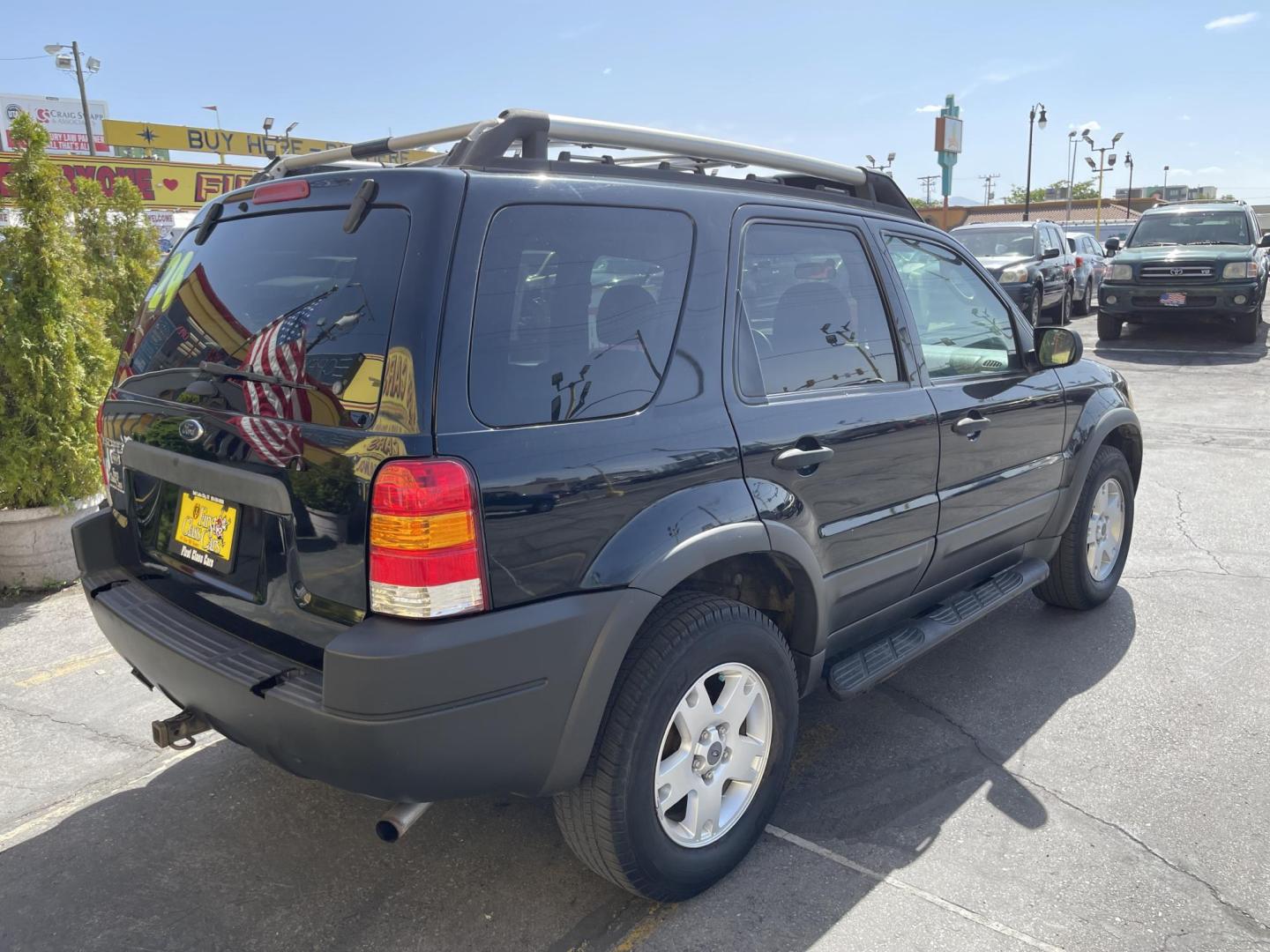 2003 Ebony /Gray Cloth Ford Escape XLT 4WD (1FMYU93123K) with an 3.0L V6 engine, Automatic transmission, located at 801 South State Street, Salt Lake City, UT, 84111, (801) 328-0098, 40.751953, -111.888206 - Clean Title!! Extra clean!! Immaculate condition!! Free Carfax!! Must see!! Warranty available!! Free Carfax!!! Vehicle Features: XLT Model, 4WD/AWD, ABS Brakes, Air Conditioning, Alloy Wheels, AM/FM Stereo, Automatic Transmission, CD Audio, Cloth Seats, Cruise Control, Full Roof Rack, Power Lo - Photo#5