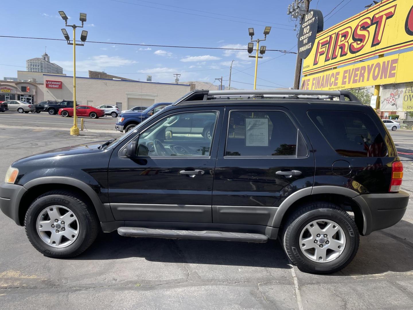 2003 Ebony /Gray Cloth Ford Escape XLT 4WD (1FMYU93123K) with an 3.0L V6 engine, Automatic transmission, located at 801 South State Street, Salt Lake City, UT, 84111, (801) 328-0098, 40.751953, -111.888206 - Clean Title!! Extra clean!! Immaculate condition!! Free Carfax!! Must see!! Warranty available!! Free Carfax!!! Vehicle Features: XLT Model, 4WD/AWD, ABS Brakes, Air Conditioning, Alloy Wheels, AM/FM Stereo, Automatic Transmission, CD Audio, Cloth Seats, Cruise Control, Full Roof Rack, Power Lo - Photo#8