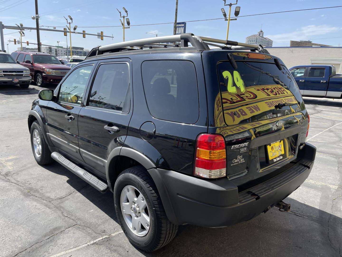 2003 Ebony /Gray Cloth Ford Escape XLT 4WD (1FMYU93123K) with an 3.0L V6 engine, Automatic transmission, located at 801 South State Street, Salt Lake City, UT, 84111, (801) 328-0098, 40.751953, -111.888206 - Clean Title!! Extra clean!! Immaculate condition!! Free Carfax!! Must see!! Warranty available!! Free Carfax!!! Vehicle Features: XLT Model, 4WD/AWD, ABS Brakes, Air Conditioning, Alloy Wheels, AM/FM Stereo, Automatic Transmission, CD Audio, Cloth Seats, Cruise Control, Full Roof Rack, Power Lo - Photo#7