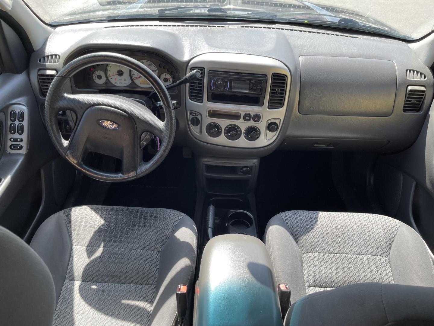 2003 Ebony /Gray Cloth Ford Escape XLT 4WD (1FMYU93123K) with an 3.0L V6 engine, Automatic transmission, located at 801 South State Street, Salt Lake City, UT, 84111, (801) 328-0098, 40.751953, -111.888206 - Clean Title!! Extra clean!! Immaculate condition!! Free Carfax!! Must see!! Warranty available!! Free Carfax!!! Vehicle Features: XLT Model, 4WD/AWD, ABS Brakes, Air Conditioning, Alloy Wheels, AM/FM Stereo, Automatic Transmission, CD Audio, Cloth Seats, Cruise Control, Full Roof Rack, Power Lo - Photo#11
