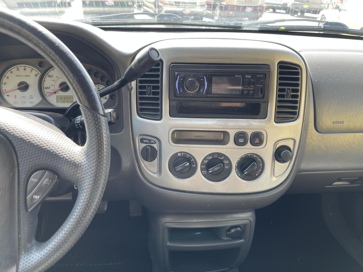 2003 Ebony /Gray Cloth Ford Escape XLT 4WD (1FMYU93123K) with an 3.0L V6 engine, Automatic transmission, located at 801 South State Street, Salt Lake City, UT, 84111, (801) 328-0098, 40.751953, -111.888206 - Clean Title!! Extra clean!! Immaculate condition!! Free Carfax!! Must see!! Warranty available!! Free Carfax!!! Vehicle Features: XLT Model, 4WD/AWD, ABS Brakes, Air Conditioning, Alloy Wheels, AM/FM Stereo, Automatic Transmission, CD Audio, Cloth Seats, Cruise Control, Full Roof Rack, Power Lo - Photo#12