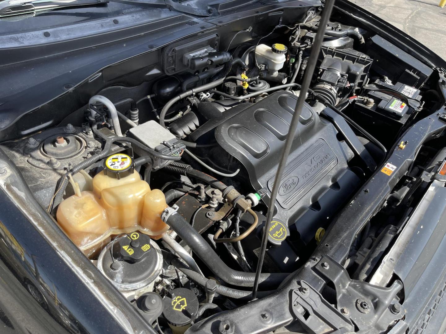 2003 Ebony /Gray Cloth Ford Escape XLT 4WD (1FMYU93123K) with an 3.0L V6 engine, Automatic transmission, located at 801 South State Street, Salt Lake City, UT, 84111, (801) 328-0098, 40.751953, -111.888206 - Clean Title!! Extra clean!! Immaculate condition!! Free Carfax!! Must see!! Warranty available!! Free Carfax!!! Vehicle Features: XLT Model, 4WD/AWD, ABS Brakes, Air Conditioning, Alloy Wheels, AM/FM Stereo, Automatic Transmission, CD Audio, Cloth Seats, Cruise Control, Full Roof Rack, Power Lo - Photo#19