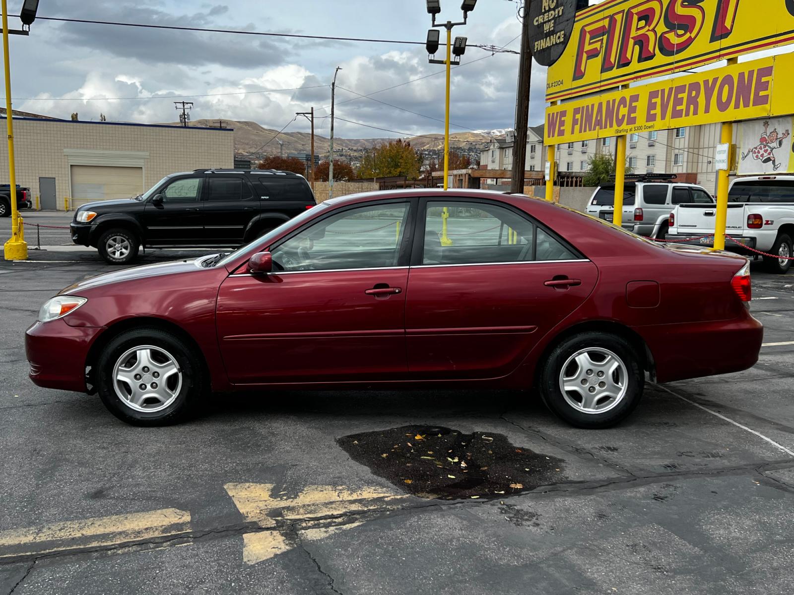2003 Salsa Red Pearl /Gray Cloth Toyota Camry LE V6 (4T1BF32K03U) with an 3.0L V6 engine, Automatic transmission, located at 801 South State Street, Salt Lake City, UT, 84111, (801) 328-0098, 40.751953, -111.888206 - Life is crazy. Now is the time to buy! All of our prices are just dollars above our cost. These prices will change as soon as life isn't so crazy. So please call or come in. We are here to save you a lot of money! Our service department is OPEN DAILY to help with any of your service needs. P - Photo #1