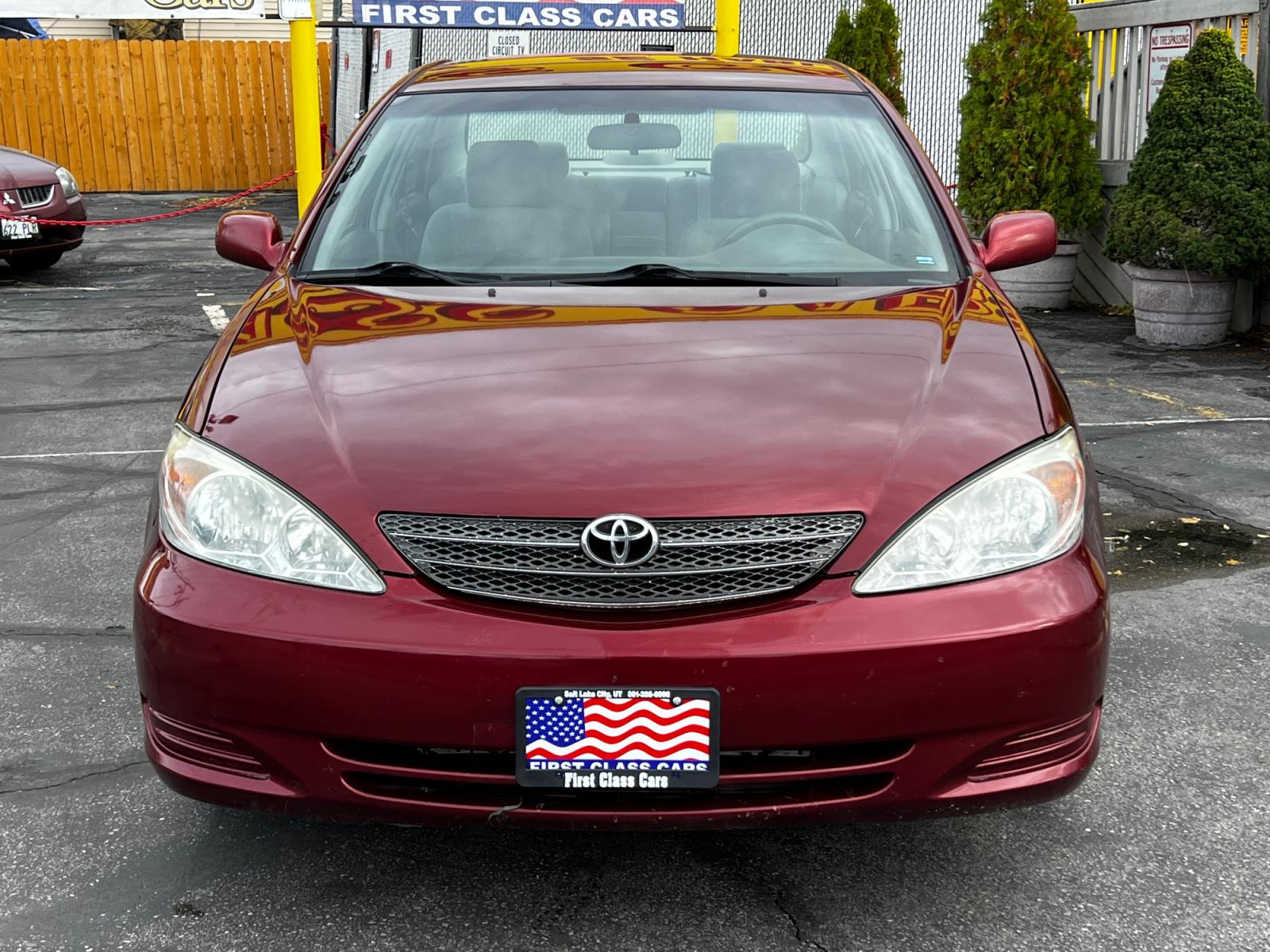 2003 Salsa Red Pearl /Gray Cloth Toyota Camry LE V6 (4T1BF32K03U) with an 3.0L V6 engine, Automatic transmission, located at 801 South State Street, Salt Lake City, UT, 84111, (801) 328-0098, 40.751953, -111.888206 - Life is crazy. Now is the time to buy! All of our prices are just dollars above our cost. These prices will change as soon as life isn't so crazy. So please call or come in. We are here to save you a lot of money! Our service department is OPEN DAILY to help with any of your service needs. P - Photo #3