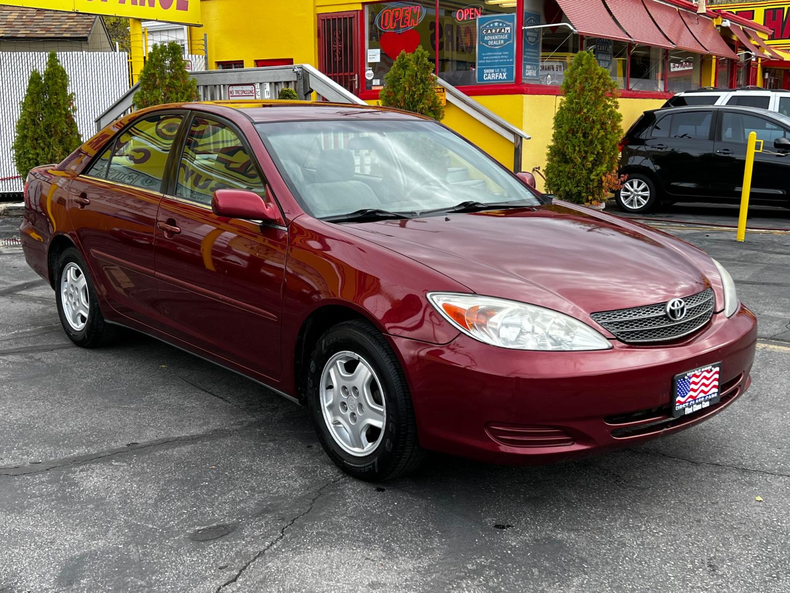 2003 Salsa Red Pearl /Gray Cloth Toyota Camry LE V6 (4T1BF32K03U) with an 3.0L V6 engine, Automatic transmission, located at 801 South State Street, Salt Lake City, UT, 84111, (801) 328-0098, 40.751953, -111.888206 - Life is crazy. Now is the time to buy! All of our prices are just dollars above our cost. These prices will change as soon as life isn't so crazy. So please call or come in. We are here to save you a lot of money! Our service department is OPEN DAILY to help with any of your service needs. P - Photo #4