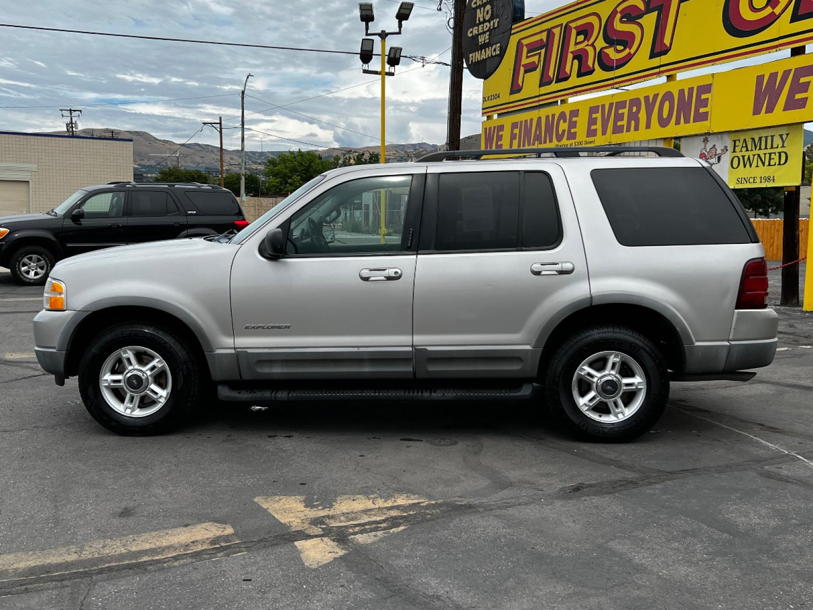 2002 Silver Frost Metallic /Gray Cloth Ford Explorer XLT 4WD (1FMZU73K82Z) with an 4.0L V6 engine, Automatic transmission, located at 801 South State Street, Salt Lake City, UT, 84111, (801) 328-0098, 40.751953, -111.888206 - Vehicle Features: XLT Model, 4WD/AWD, ABS Brakes, Air Conditioning, Alloy Wheels, AM/FM Stereo, Automatic Transmission, CD Audio, Cloth Seats, Cruise Control, Fold-Away Third Row, Full Roof Rack, Power Locks, Power Mirrors, Power Seat(s), Power Windows, Rear Air Conditioning, Rear Defroster, Run - Photo #1