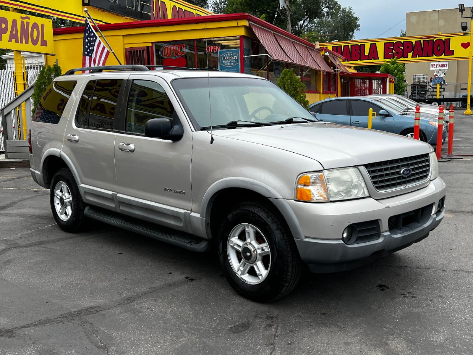 2002 Silver Frost Metallic /Gray Cloth Ford Explorer XLT 4WD (1FMZU73K82Z) with an 4.0L V6 engine, Automatic transmission, located at 801 South State Street, Salt Lake City, UT, 84111, (801) 328-0098, 40.751953, -111.888206 - Vehicle Features: XLT Model, 4WD/AWD, ABS Brakes, Air Conditioning, Alloy Wheels, AM/FM Stereo, Automatic Transmission, CD Audio, Cloth Seats, Cruise Control, Fold-Away Third Row, Full Roof Rack, Power Locks, Power Mirrors, Power Seat(s), Power Windows, Rear Air Conditioning, Rear Defroster, Run - Photo #4