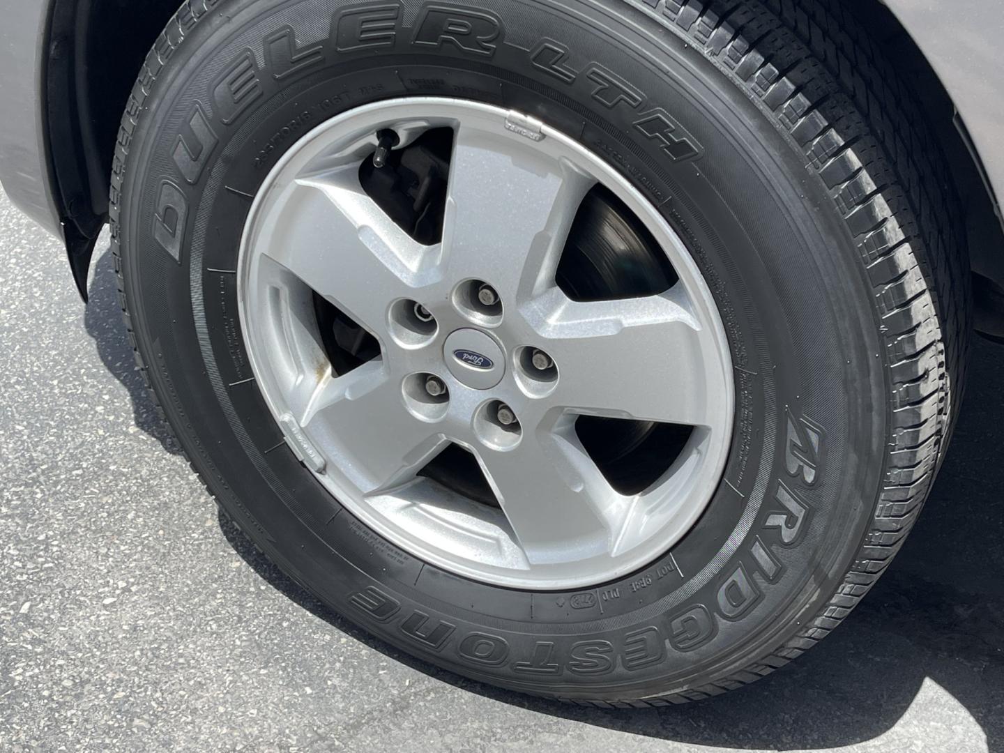 2009 Sterling Gray Metallic /Gray Cloth Ford Escape XLT 4WD V6 (1FMCU93G89K) with an 3.0L V6 engine, Automatic transmission, located at 801 South State Street, Salt Lake City, UT, 84111, (801) 328-0098, 40.751953, -111.888206 - Life is crazy. Now is the time to buy! All of our prices are just dollars above our cost. These prices will change as soon as life isn't so crazy. So please call or come in. We are here to save you a lot of money! Our service department is OPEN DAILY to help with any of your service needs. P- Photo#11