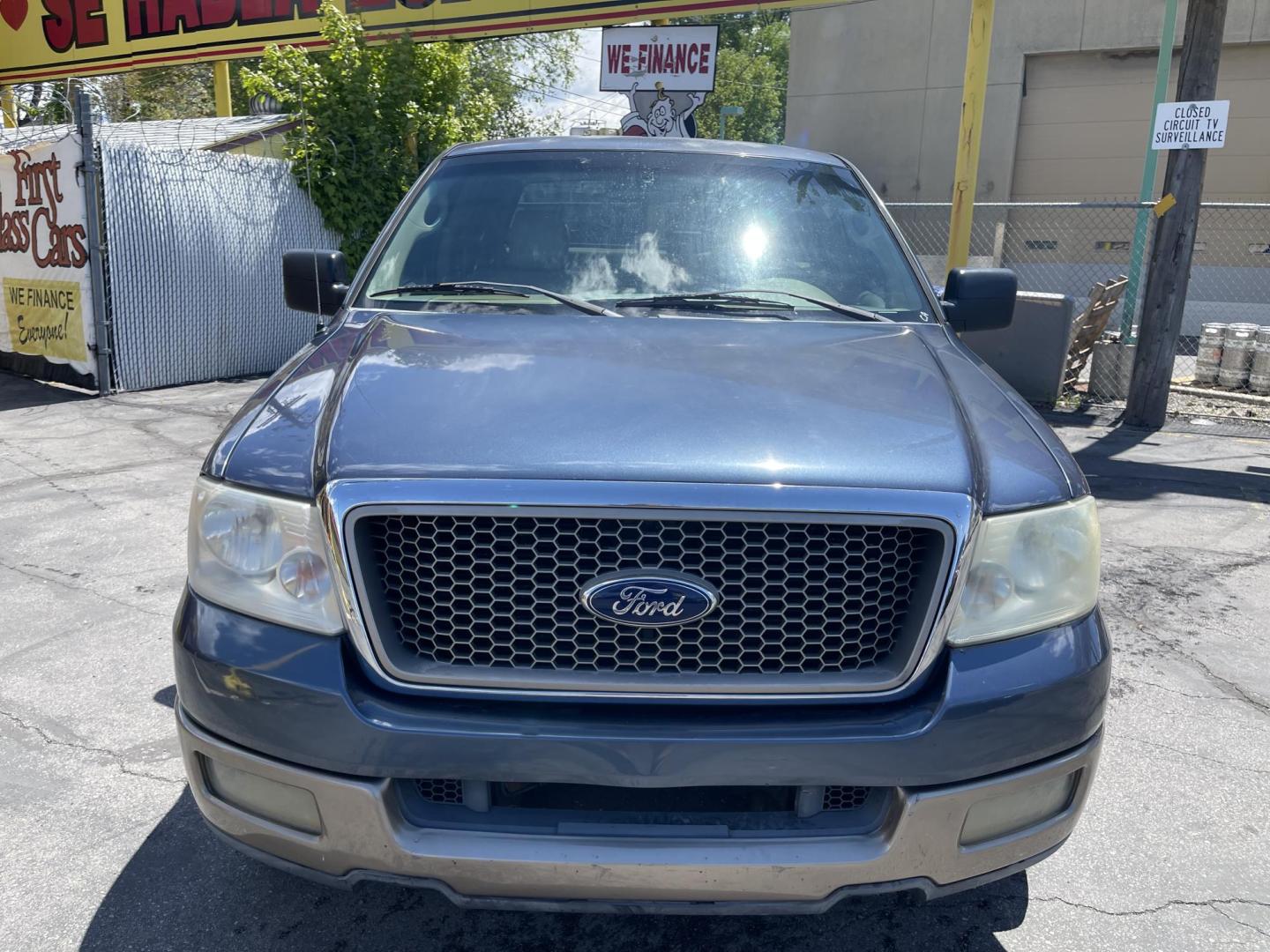 2004 True Blue Metallic /Tan Leather Ford F-150 Lariat SuperCrew (1FTPW12504K) with an 5.4L V8 engine, Automatic transmission, located at 801 South State Street, Salt Lake City, UT, 84111, (801) 328-0098, 40.751953, -111.888206 - Vehicle Features: Lariat Model, SuperCrew 4 Door, ABS Brakes, Traction Control, Cruise Control, Air Conditioning, AM/FM Stereo, CD Player, Leather Interior, Power Windows, Power Locks, Power Mirrors, Heated Seats, Power Seat(s), Privacy Glass, Tow Package, Running Boards, Alloy Wheels, Bedliner. Li - Photo#2
