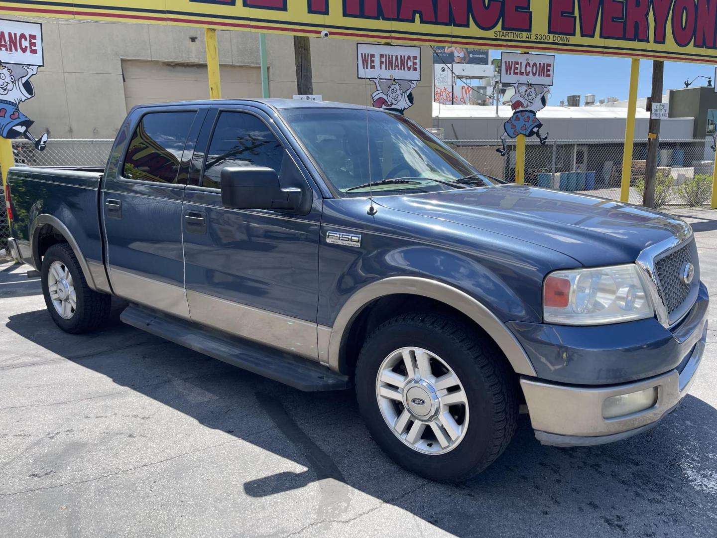 2004 True Blue Metallic /Tan Leather Ford F-150 Lariat SuperCrew (1FTPW12504K) with an 5.4L V8 engine, Automatic transmission, located at 801 South State Street, Salt Lake City, UT, 84111, (801) 328-0098, 40.751953, -111.888206 - Vehicle Features: Lariat Model, SuperCrew 4 Door, ABS Brakes, Traction Control, Cruise Control, Air Conditioning, AM/FM Stereo, CD Player, Leather Interior, Power Windows, Power Locks, Power Mirrors, Heated Seats, Power Seat(s), Privacy Glass, Tow Package, Running Boards, Alloy Wheels, Bedliner. Li - Photo#3