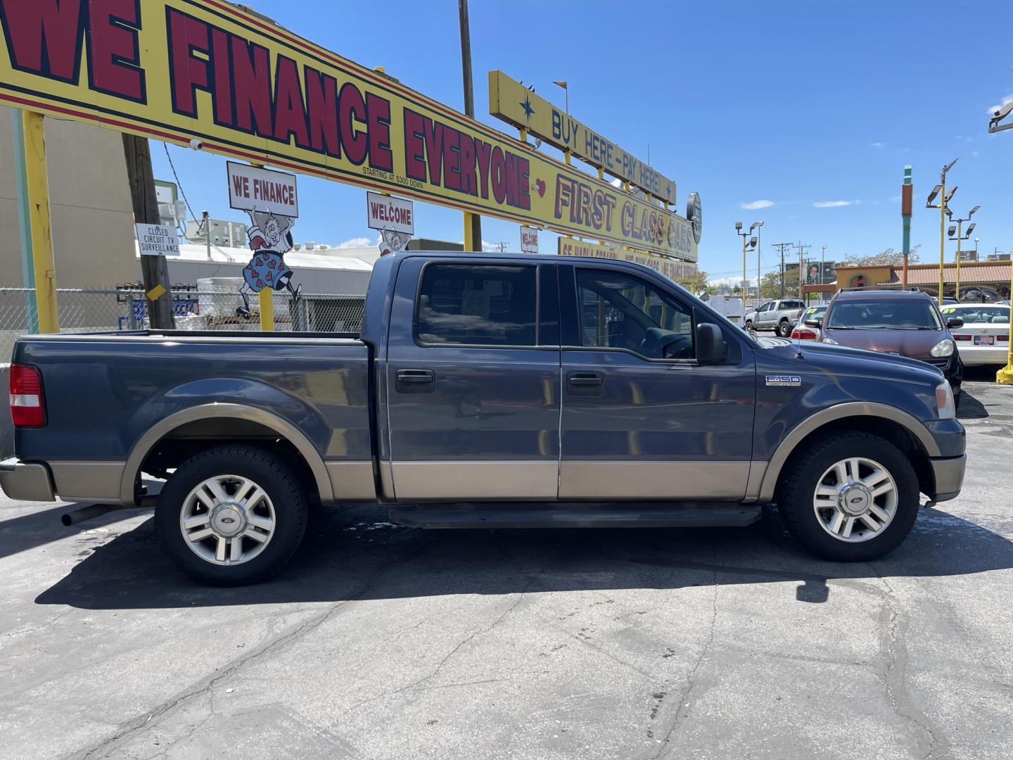 2004 True Blue Metallic /Tan Leather Ford F-150 Lariat SuperCrew (1FTPW12504K) with an 5.4L V8 engine, Automatic transmission, located at 801 South State Street, Salt Lake City, UT, 84111, (801) 328-0098, 40.751953, -111.888206 - Vehicle Features: Lariat Model, SuperCrew 4 Door, ABS Brakes, Traction Control, Cruise Control, Air Conditioning, AM/FM Stereo, CD Player, Leather Interior, Power Windows, Power Locks, Power Mirrors, Heated Seats, Power Seat(s), Privacy Glass, Tow Package, Running Boards, Alloy Wheels, Bedliner. Li - Photo#4