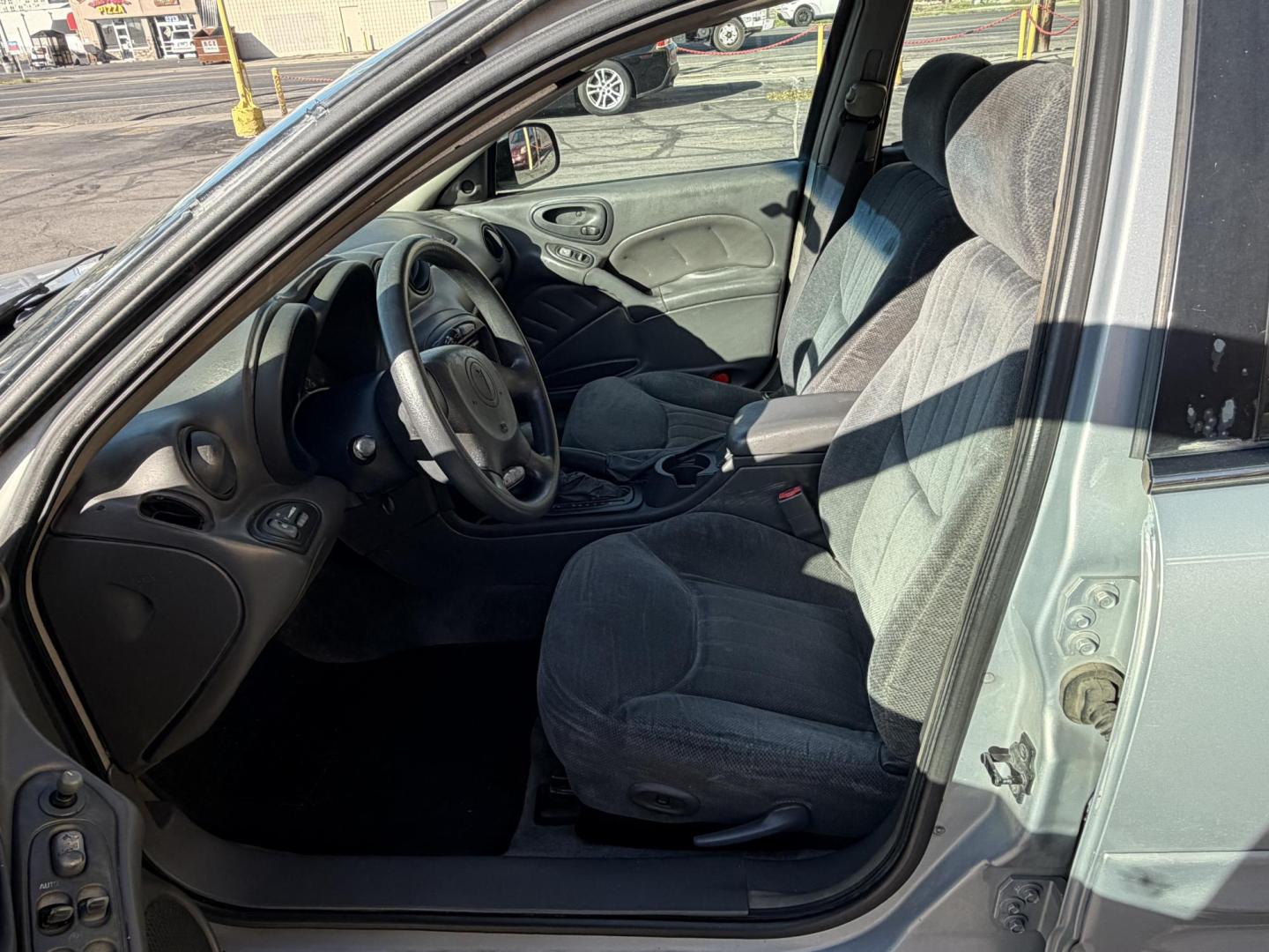 2000 Silvermist Metallic /Gray Cloth Pontiac Grand AM SE1 (1G2NF52T0YC) with an 2.4L 4 Cyl. engine, Automatic transmission, located at 801 South State Street, Salt Lake City, UT, 84111, (801) 328-0098, 40.751953, -111.888206 - Clean title! Vehicle Features: SE1 Model, ABS Brakes, Air Conditioning, Alloy Wheels, AM/FM Stereo, Automatic Transmission, CD Audio, Cloth Seats, Cruise Control, Power Locks, Power Mirrors, Power Windows, Rear Defroster, Traction Control * All advertised prices are just dollars above cost to ma - Photo#10