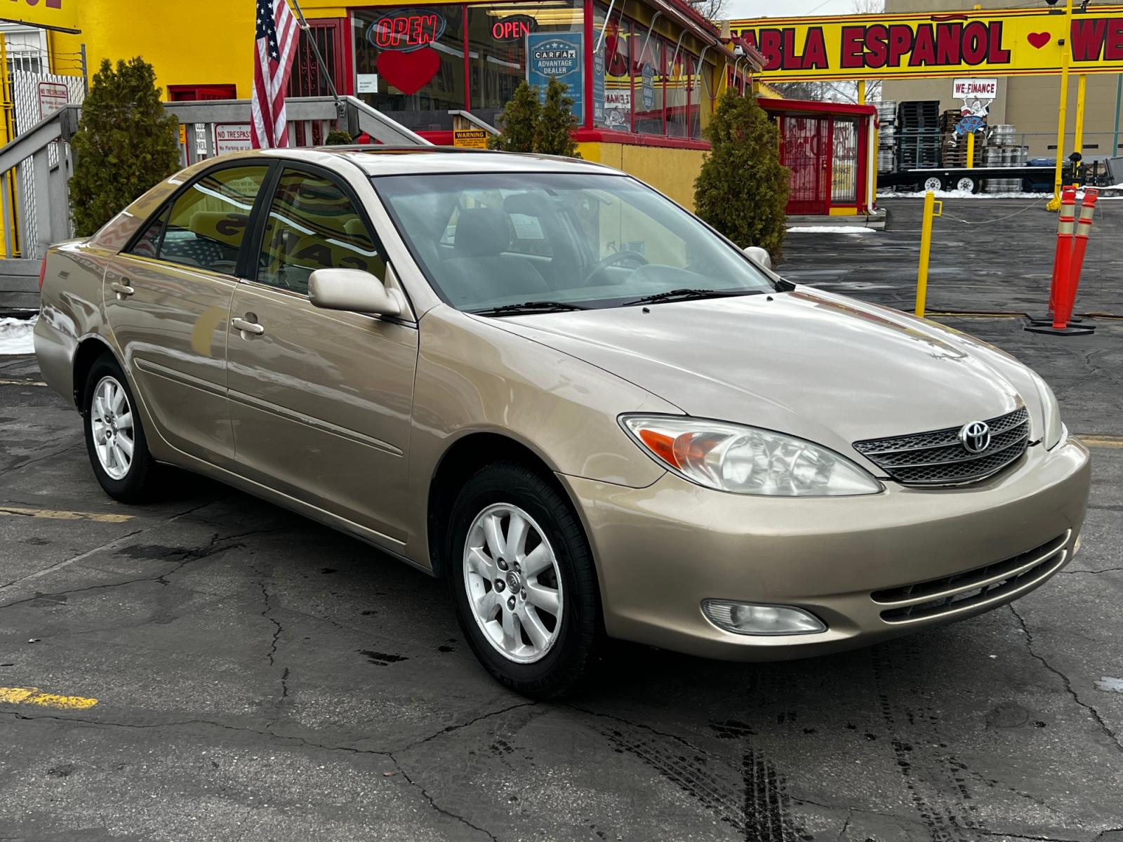 2003 Desert Sand Mica /Tan Cloth Toyota Camry XLE (4T1BE30K03U) with an 2.4L 4 Cyl. engine, located at 801 South State Street, Salt Lake City, UT, 84111, (801) 328-0098, 40.751953, -111.888206 - Features: XLE Model, 2.4L I-4, Automatic Transmission, Front Wheel Drive, ABS Brakes, Air Conditioning, Alloy Wheels, JBL,Sound System, AM-FM Stereo, Cassette Player, CD Player, Cruise Control, Power Windows, Power Locks, Power Mirrors, Power Sunroof, Power Seat(s), Rear Defroster - Photo #4