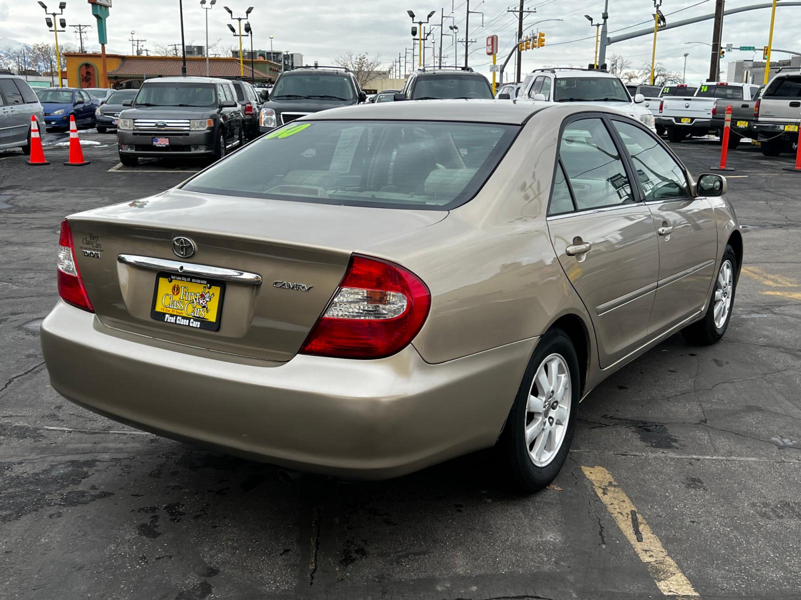 2003 Desert Sand Mica /Tan Cloth Toyota Camry XLE (4T1BE30K03U) with an 2.4L 4 Cyl. engine, located at 801 South State Street, Salt Lake City, UT, 84111, (801) 328-0098, 40.751953, -111.888206 - Features: XLE Model, 2.4L I-4, Automatic Transmission, Front Wheel Drive, ABS Brakes, Air Conditioning, Alloy Wheels, JBL,Sound System, AM-FM Stereo, Cassette Player, CD Player, Cruise Control, Power Windows, Power Locks, Power Mirrors, Power Sunroof, Power Seat(s), Rear Defroster - Photo #6