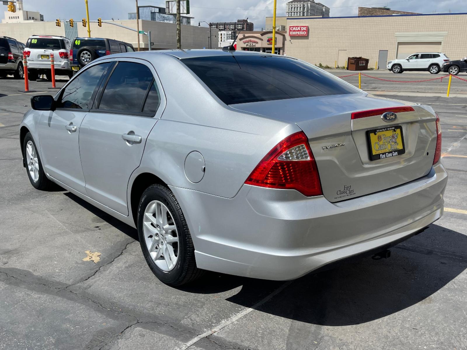 2012 Moondust Silver Metallic /Gray Cloth Ford Fusion S (3FAHP0GA1CR) with an 2.5L 4 Cyl. engine, Automatic transmission, located at 801 South State Street, Salt Lake City, UT, 84111, (801) 328-0098, 40.751953, -111.888206 - Life is crazy. Now is the time to buy! All of our prices are just dollars above our cost. These prices will change as soon as life isn't so crazy. So please call or come in. We are here to save you a lot of money! Our service department is OPEN DAILY to help with any of your service need - Photo #8