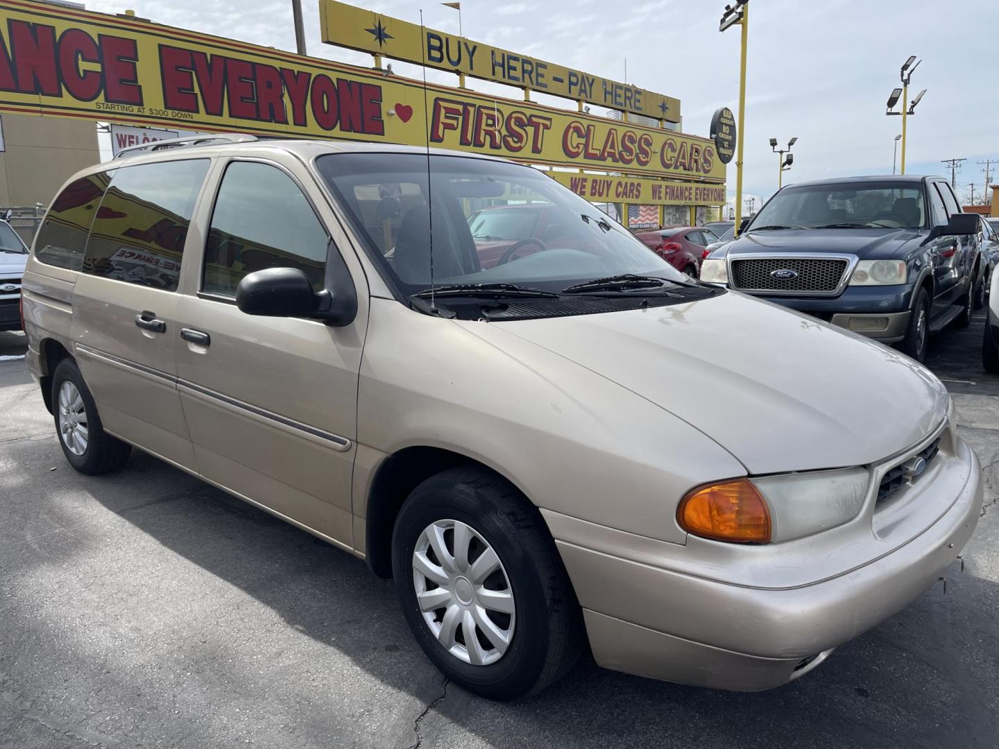 1998 Light Saddle Metallic /Tan Cloth Ford Windstar Base (2FMDA5141WB) with an 3.8L V6 engine, Automatic transmission, located at 801 South State Street, Salt Lake City, UT, 84111, (801) 328-0098, 40.751953, -111.888206 - 1998 Ford Windstar basic commuter van to get to and from work. Features: Automatic, power windows, power lock, hub caps, am/fm/cassett, 3.8 liter 6 cylinder, clean title history, passed emissions ready for licensing. * All advertised prices are just dollars above cost to make room for new invent - Photo#2