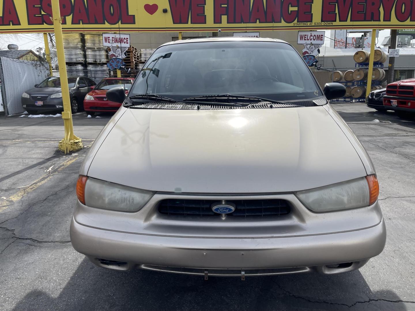 1998 Light Saddle Metallic /Tan Cloth Ford Windstar Base (2FMDA5141WB) with an 3.8L V6 engine, Automatic transmission, located at 801 South State Street, Salt Lake City, UT, 84111, (801) 328-0098, 40.751953, -111.888206 - 1998 Ford Windstar basic commuter van to get to and from work. Features: Automatic, power windows, power lock, hub caps, am/fm/cassett, 3.8 liter 6 cylinder, clean title history, passed emissions ready for licensing. * All advertised prices are just dollars above cost to make room for new invent - Photo#1