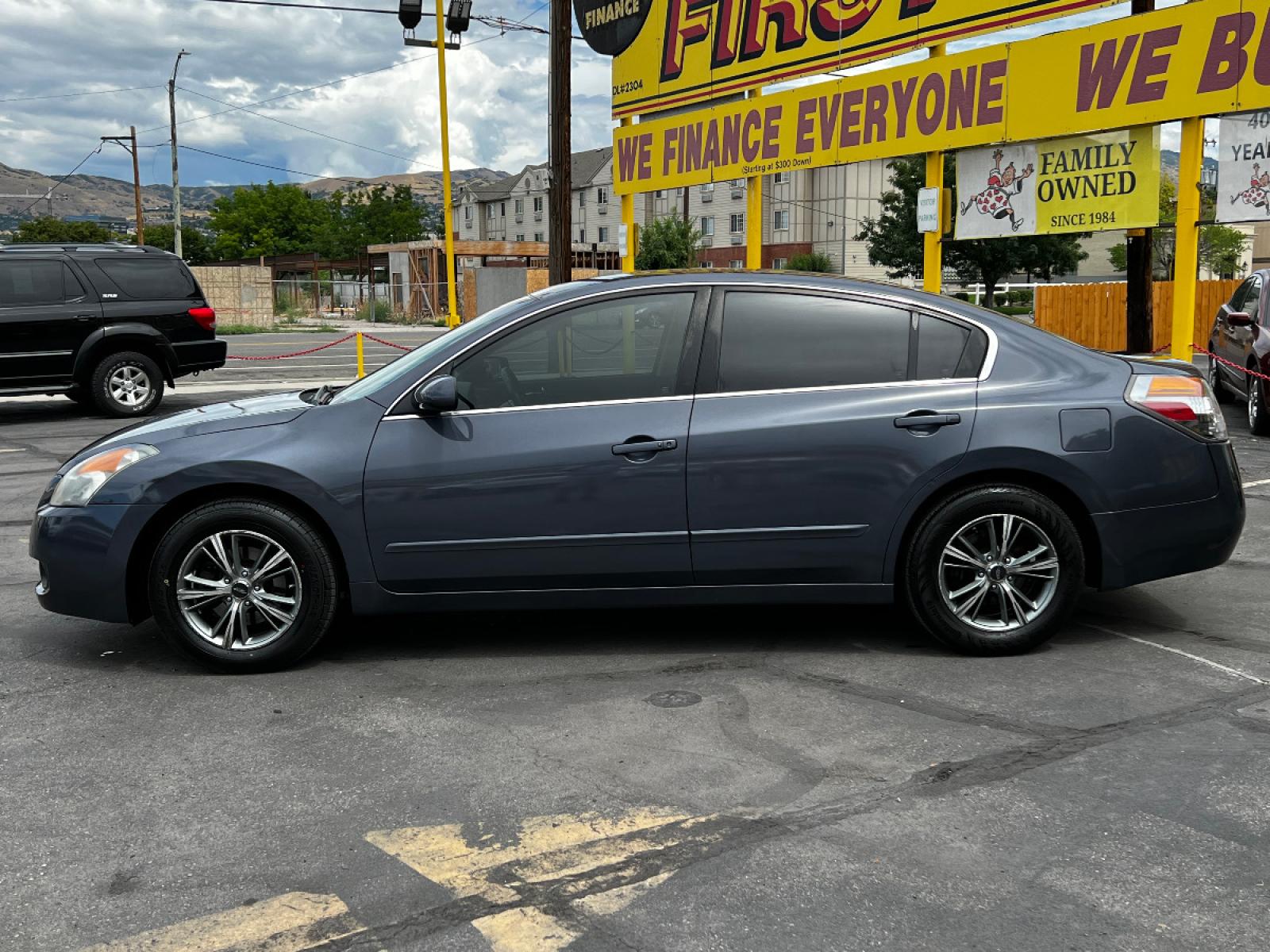 2009 Dark Slate Metallic /Gray Cloth Nissan Altima 2.5 S (1N4AL21E69N) with an 2.5L 4 Cyl. engine, Automatic transmission, located at 801 South State Street, Salt Lake City, UT, 84111, (801) 328-0098, 40.751953, -111.888206 - Life is crazy. Now is the time to buy! All of our prices are just dollars above our cost. These prices will change as soon as life isn't so crazy. So please call or come in. We are here to save you a lot of money! Our service department is OPEN DAILY to help with any of your service needs. P - Photo #1