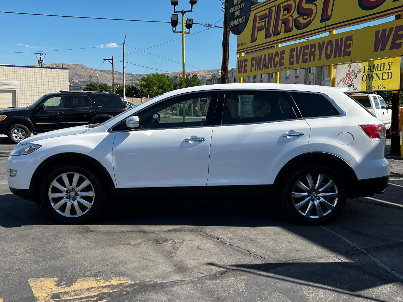 2009 Crystal White Pearl Mazda CX-9 Grand Touring FWD (JM3TB28A090) with an 3.7L V6 engine, Automatic transmission, located at 801 South State Street, Salt Lake City, UT, 84111, (801) 328-0098, 40.751953, -111.888206 - Life is crazy. Now is the time to buy! All of our prices are just dollars above our cost. These prices will change as soon as life isn't so crazy. So please call or come in. We are here to save you a lot of money! Our service department is OPEN DAILY to help with any of your service needs. P - Photo #1