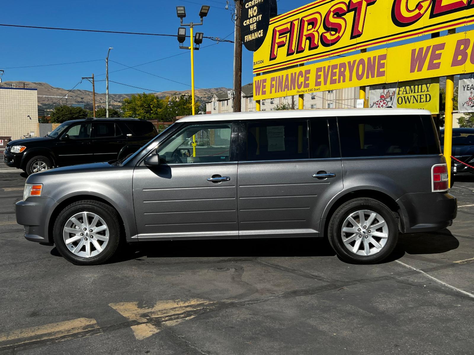 2009 Sterling Gray Metallic Ford Flex SEL (2FMDK52C49B) with an 3.5L V6 engine, Automatic transmission, located at 801 South State Street, Salt Lake City, UT, 84111, (801) 328-0098, 40.751953, -111.888206 - Life is crazy. Now is the time to buy! All of our prices are just dollars above our cost. These prices will change as soon as life isn't so crazy. So please call or come in. We are here to save you a lot of money! Our service department is OPEN DAILY to help with any of your service needs. P - Photo #1