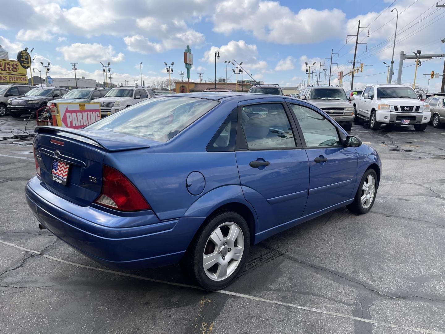 2004 French Blue Metallic /Gray Cloth Ford Focus ZTS (1FAFP38Z04W) with an 2.3L 4 Cyl. engine, Manual transmission, located at 801 South State Street, Salt Lake City, UT, 84111, (801) 328-0098, 40.751953, -111.888206 - Vehicle Features:ABS Brakes, Air Conditioning, Alloy Wheels, AM/FM Stereo, CD Audio, Cloth Seats, Cruise Control, Manual Transmission, Power Locks, Power Mirrors, Power Windows, Rear Defroster, Sunroof(s), Traction Control Our service department is OPEN DAILY to help with any of your service needs - Photo#5