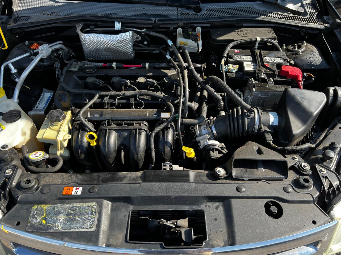 2011 Panther Black Metallic /Gray Cloth Ford Focus SE Sedan (1FAHP3FN8BW) with an 2.0L 4 Cyl. engine, Automatic transmission, located at 801 South State Street, Salt Lake City, UT, 84111, (801) 328-0098, 40.751953, -111.888206 - Life is crazy. Now is the time to buy! All of our prices are just dollars above our cost. These prices will change as soon as life isn't so crazy. So please call or come in. We are here to save you a lot of money! Our service department is OPEN DAILY to help with any of your service needs. Ple - Photo#11