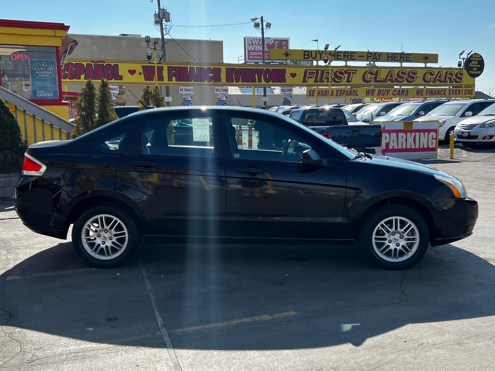 2011 Panther Black Metallic /Gray Cloth Ford Focus SE Sedan (1FAHP3FN8BW) with an 2.0L 4 Cyl. engine, Automatic transmission, located at 801 South State Street, Salt Lake City, UT, 84111, (801) 328-0098, 40.751953, -111.888206 - Life is crazy. Now is the time to buy! All of our prices are just dollars above our cost. These prices will change as soon as life isn't so crazy. So please call or come in. We are here to save you a lot of money! Our service department is OPEN DAILY to help with any of your service needs. P - Photo #5