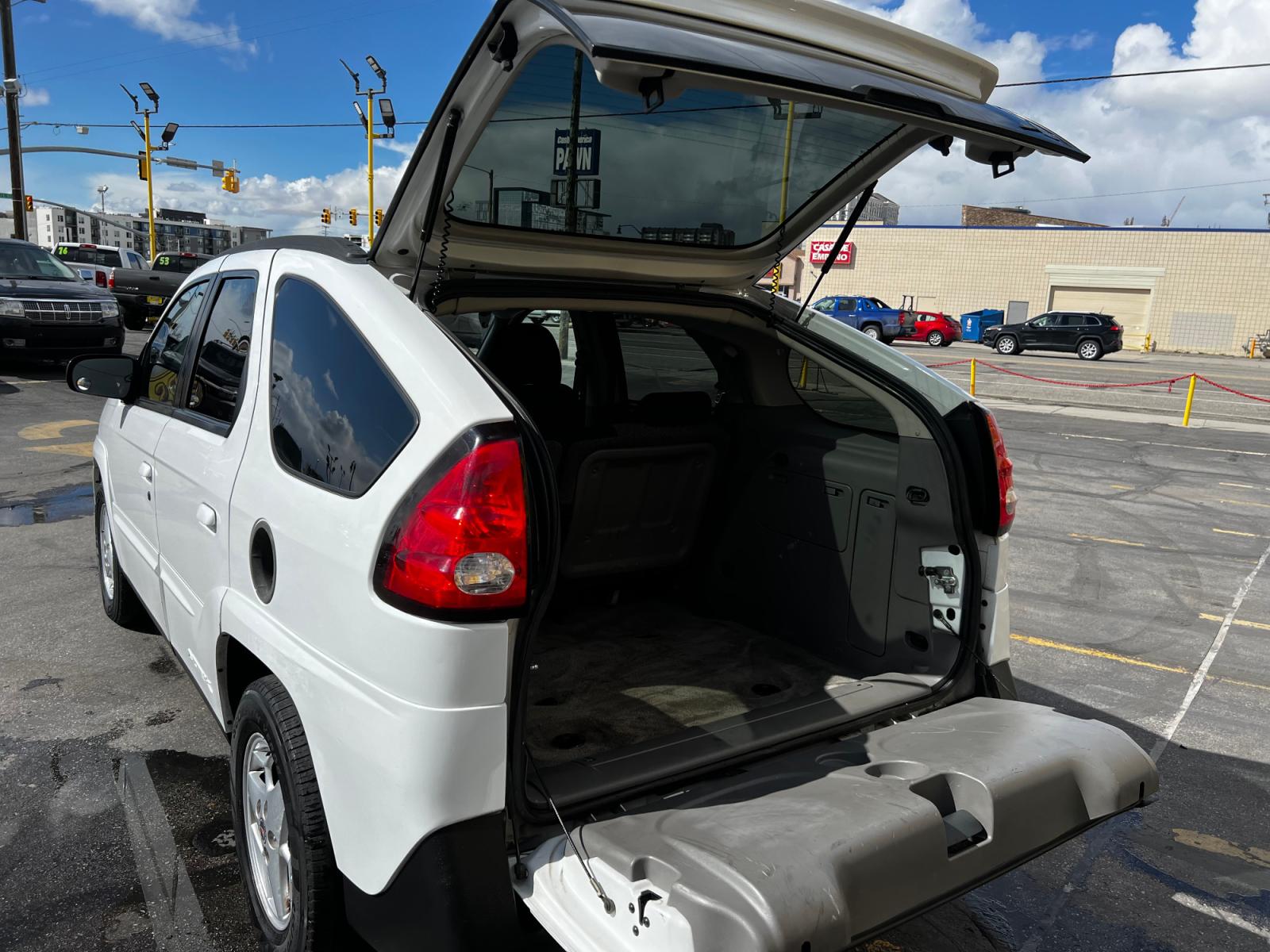 2004 Olympic White /Gray Cloth Pontiac Aztek AWD (3G7DB03E74S) with an 3.4L V6 engine, Automatic transmission, located at 801 South State Street, Salt Lake City, UT, 84111, (801) 328-0098, 40.751953, -111.888206 - Life is crazy. Now is the time to buy! All of our prices are just dollars above our cost. These prices will change as soon as life isn't so crazy. So please call or come in. We are here to save you a lot of money! Our service department is OPEN DAILY to help with any of your service needs. P - Photo #25