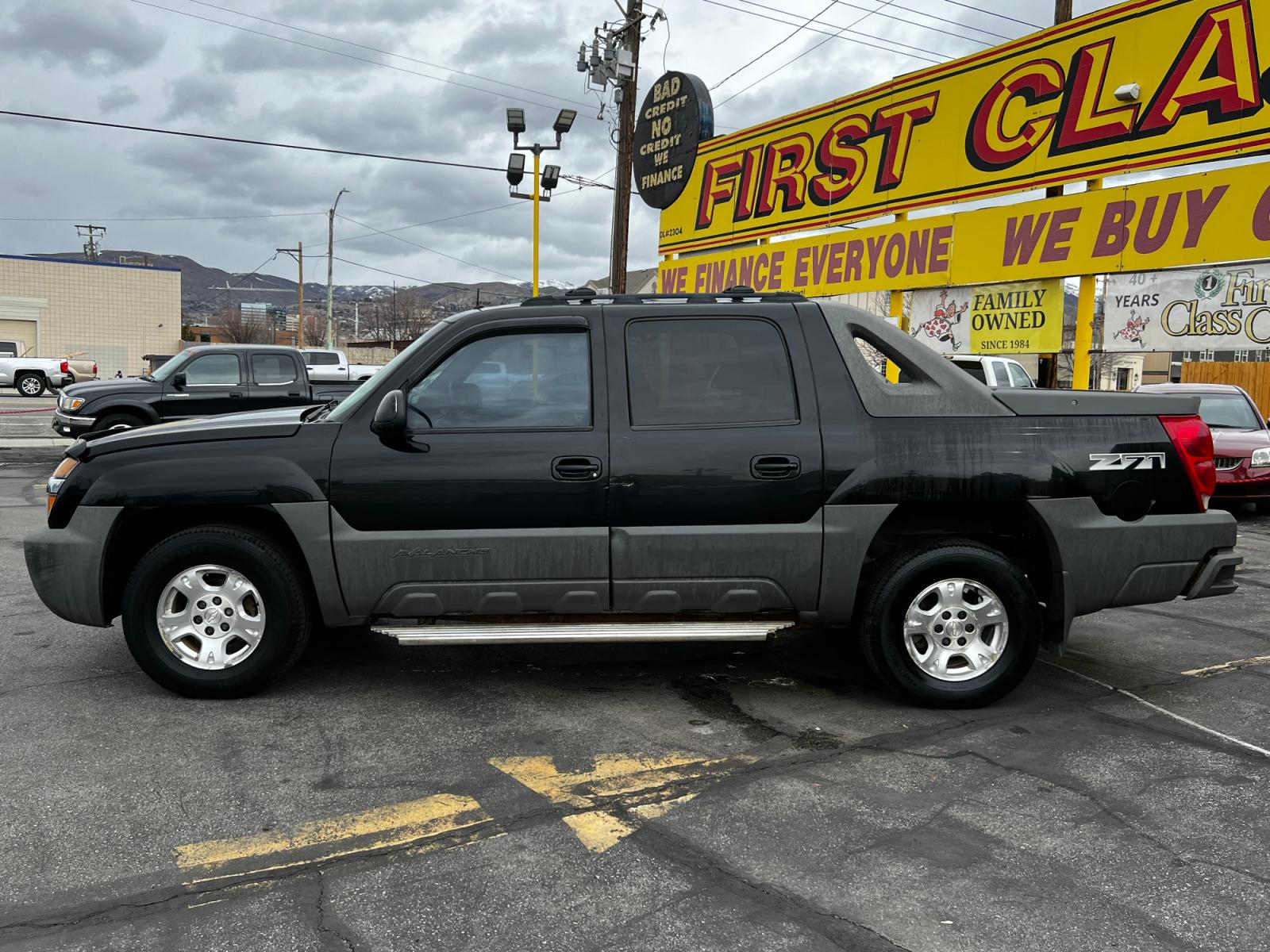 2002 Black /Black Leather Chevrolet Avalanche Z71 1500 4WD (3GNEK13T92G) with an 5.3L V8 engine, Automatic transmission, located at 801 South State Street, Salt Lake City, UT, 84111, (801) 328-0098, 40.751953, -111.888206 - Life is crazy. Now is the time to buy! All of our prices are just dollars above our cost. These prices will change as soon as life isn't so crazy. So please call or come in. We are here to save you a lot of money! Our service department is OPEN DAILY to help with any of your service needs. P - Photo #1