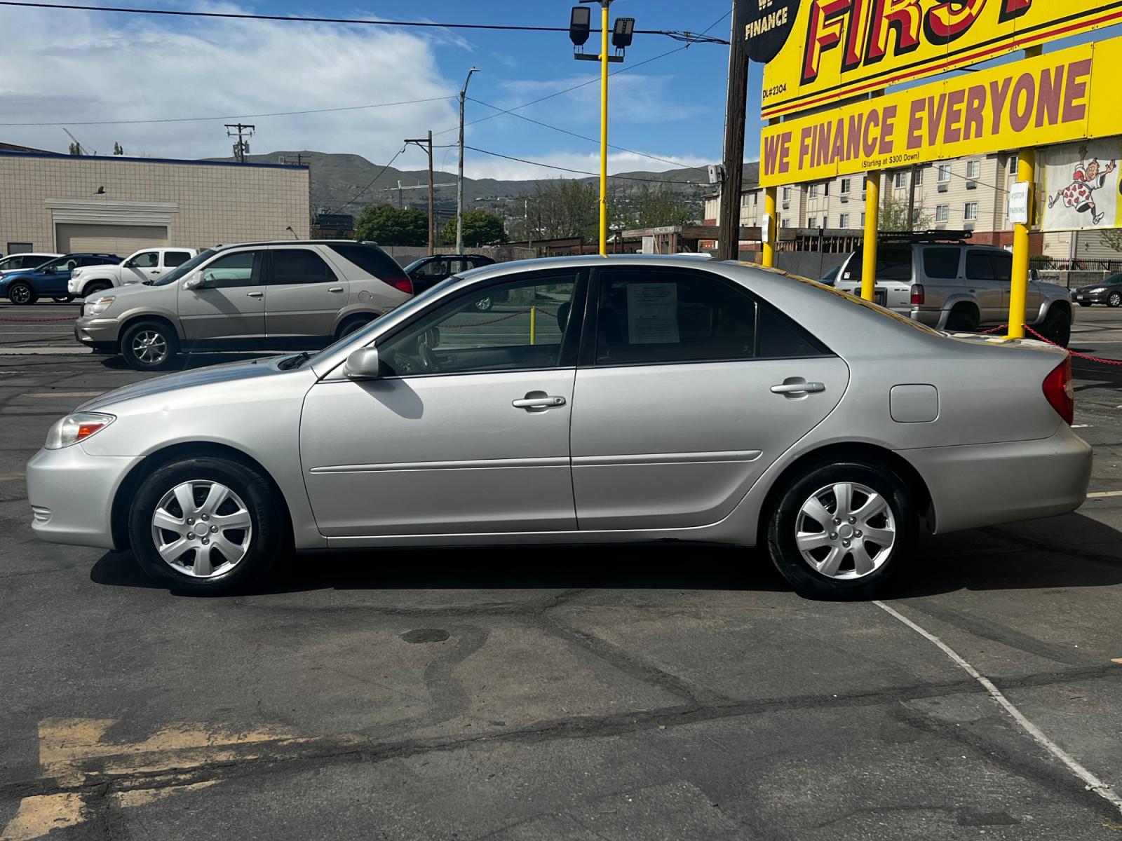 2004 Silver Streak Mica /Gray Cloth Toyota Camry LE (4T1BE32K14U) with an 2.4L 4 Cyl. engine, Automatic transmission, located at 801 South State Street, Salt Lake City, UT, 84111, (801) 328-0098, 40.751953, -111.888206 - Life is crazy. Now is the time to buy! All of our prices are just dollars above our cost. These prices will change as soon as life isn't so crazy. So please call or come in. We are here to save you a lot of money! Our service department is OPEN DAILY to help with any of your service needs. P - Photo #1