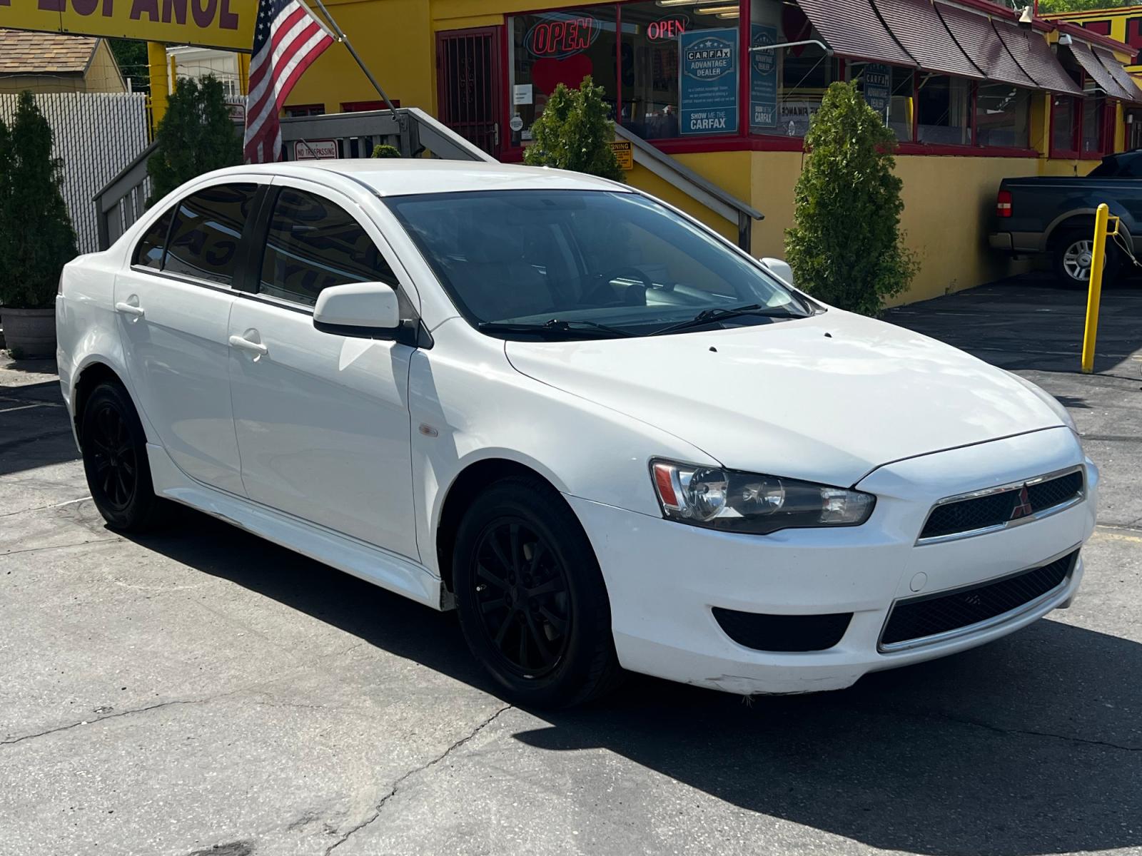 2012 Fairy White /Tan Cloth Mitsubishi Lancer SE (JA32V2FW4CU) with an 2.4L 4 Cyl. engine, Automatic transmission, located at 801 South State Street, Salt Lake City, UT, 84111, (801) 328-0098, 40.751953, -111.888206 - Life is crazy. Now is the time to buy! All of our prices are just dollars above our cost. These prices will change as soon as life isn't so crazy. So please call or come in. We are here to save you a lot of money! Our service department is OPEN DAILY to help with any of your service needs. P - Photo #4