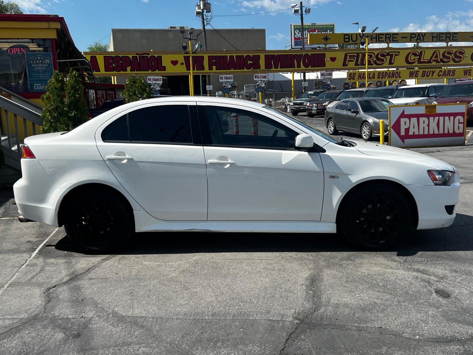2012 Fairy White /Tan Cloth Mitsubishi Lancer SE (JA32V2FW4CU) with an 2.4L 4 Cyl. engine, Automatic transmission, located at 801 South State Street, Salt Lake City, UT, 84111, (801) 328-0098, 40.751953, -111.888206 - Life is crazy. Now is the time to buy! All of our prices are just dollars above our cost. These prices will change as soon as life isn't so crazy. So please call or come in. We are here to save you a lot of money! Our service department is OPEN DAILY to help with any of your service needs. P - Photo #5