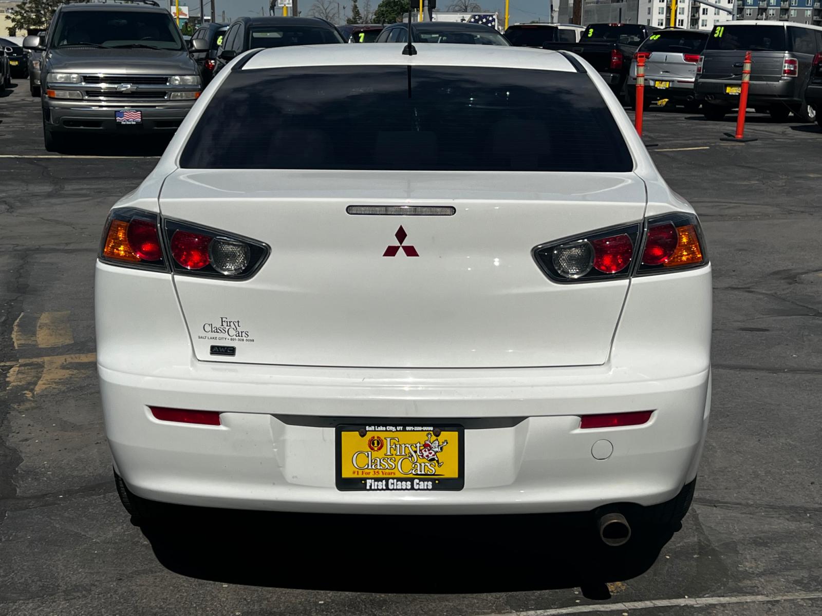 2012 Fairy White /Tan Cloth Mitsubishi Lancer SE (JA32V2FW4CU) with an 2.4L 4 Cyl. engine, Automatic transmission, located at 801 South State Street, Salt Lake City, UT, 84111, (801) 328-0098, 40.751953, -111.888206 - Life is crazy. Now is the time to buy! All of our prices are just dollars above our cost. These prices will change as soon as life isn't so crazy. So please call or come in. We are here to save you a lot of money! Our service department is OPEN DAILY to help with any of your service needs. P - Photo #7