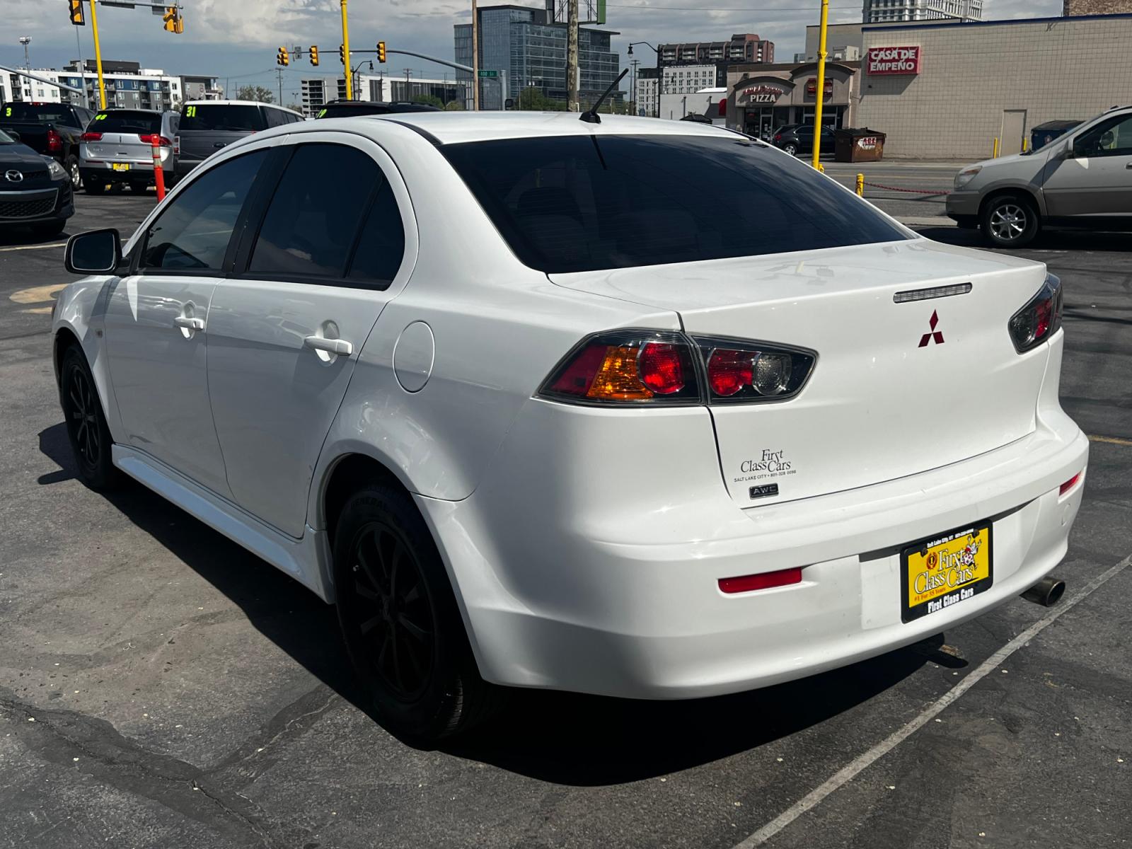 2012 Fairy White /Tan Cloth Mitsubishi Lancer SE (JA32V2FW4CU) with an 2.4L 4 Cyl. engine, Automatic transmission, located at 801 South State Street, Salt Lake City, UT, 84111, (801) 328-0098, 40.751953, -111.888206 - Life is crazy. Now is the time to buy! All of our prices are just dollars above our cost. These prices will change as soon as life isn't so crazy. So please call or come in. We are here to save you a lot of money! Our service department is OPEN DAILY to help with any of your service needs. P - Photo #8