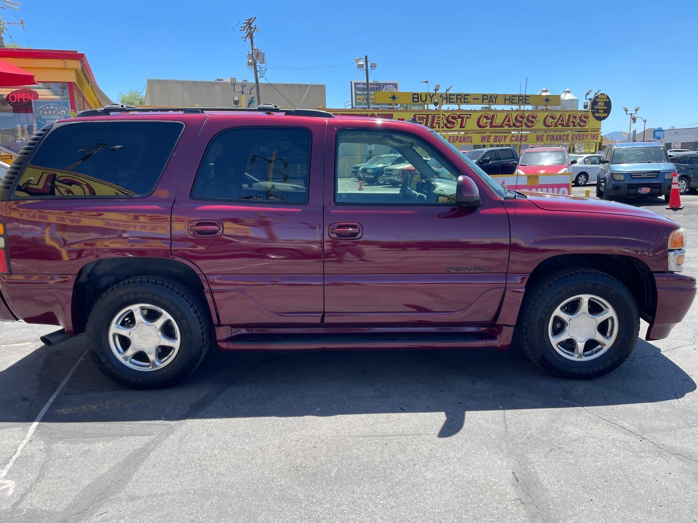 2005 Sport Red Metallic /Gray Leather GMC Yukon Denali Denali (1GKEK63U55J) with an 6.0L V8 engine, Automatic transmission, located at 801 South State Street, Salt Lake City, UT, 84111, (801) 328-0098, 40.751953, -111.888206 - We are here to save you a lot of money! Our service department is OPEN DAILY to help with any of your service needs. Please call for immediate appointment! Clean Title!! Extra clean!! Immaculate condition!! Free Carfax!! Must see!! Warranty available!! Free Carfax!!! Vehicle Features:Dena - Photo#3