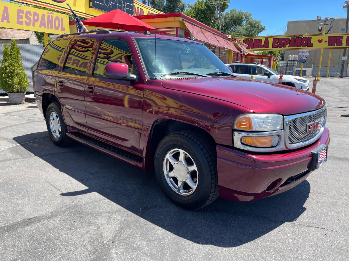 2005 Sport Red Metallic /Gray Leather GMC Yukon Denali Denali (1GKEK63U55J) with an 6.0L V8 engine, Automatic transmission, located at 801 South State Street, Salt Lake City, UT, 84111, (801) 328-0098, 40.751953, -111.888206 - We are here to save you a lot of money! Our service department is OPEN DAILY to help with any of your service needs. Please call for immediate appointment! Clean Title!! Extra clean!! Immaculate condition!! Free Carfax!! Must see!! Warranty available!! Free Carfax!!! Vehicle Features:Dena - Photo#2