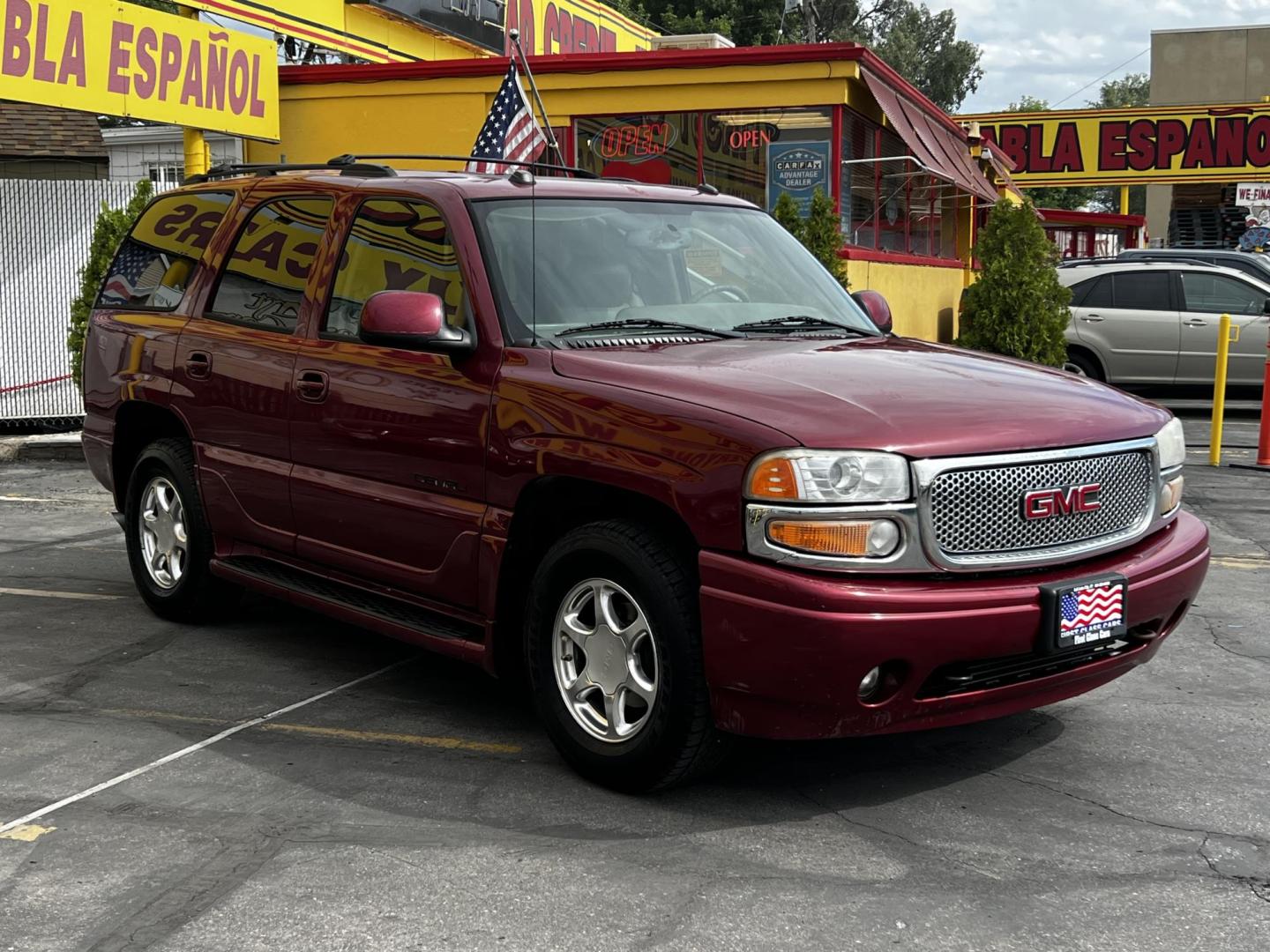2005 Sport Red Metallic /Gray Leather GMC Yukon Denali Denali (1GKEK63U55J) with an 6.0L V8 engine, Automatic transmission, located at 801 South State Street, Salt Lake City, UT, 84111, (801) 328-0098, 40.751953, -111.888206 - We are here to save you a lot of money! Our service department is OPEN DAILY to help with any of your service needs. Please call for immediate appointment! Clean Title!! Extra clean!! Immaculate condition!! Free Carfax!! Must see!! Warranty available!! Free Carfax!!! Vehicle Features:Dena - Photo#1