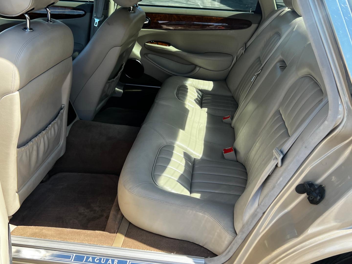 1999 Topaz Metallic /Tan Leather Jaguar XJ Sedan XJ8 L (SAJHX6047XC) with an 4.0L V8 engine, Automatic transmission, located at 801 South State Street, Salt Lake City, UT, 84111, (801) 328-0098, 40.751953, -111.888206 - Life is crazy. Now is the time to buy! All of our prices are just dollars above our cost. These prices will change as soon as life isn't so crazy. So please call or come in. We are here to save you a lot of money! Our service department is OPEN DAILY to help with any of your service needs. Please ca - Photo#22
