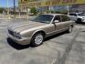 1999 Topaz Metallic /Tan Leather Jaguar XJ Sedan XJ8 L (SAJHX6047XC) with an 4.0L V8 engine, Automatic transmission, located at 801 South State Street, Salt Lake City, UT, 84111, (801) 328-0098, 40.751953, -111.888206 - Life is crazy. Now is the time to buy! All of our prices are just dollars above our cost. These prices will change as soon as life isn't so crazy. So please call or come in. We are here to save you a lot of money! Our service department is OPEN DAILY to help with any of your service needs. Please ca - Photo#11