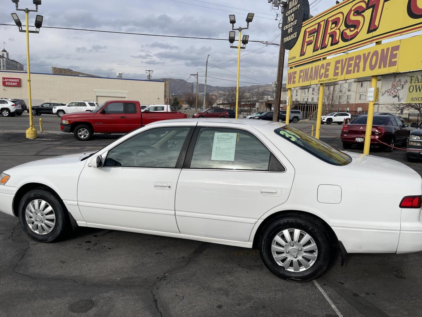 1999 Pure White /Tan Toyota Camry LE (JT2BG28KXX0) with an 2.2Liter 4 Cylinder engine, Automatic transmission, located at 801 South State Street, Salt Lake City, UT, 84111, (801) 328-0098, 40.751953, -111.888206 - Top Features:Cloth Seats, ABS Brakes, CD Audio, Power Mirrors, Side Airbags, AM/FM Stereo, Cassette Player, Power Seat(s), Air Conditioning, Cruise Control, Power Windows, Automatic Transmission, Power Locks, Rear Defroster "Experience unbeatable reliability with this 1999 used Toyota Camry. Boasti - Photo#8