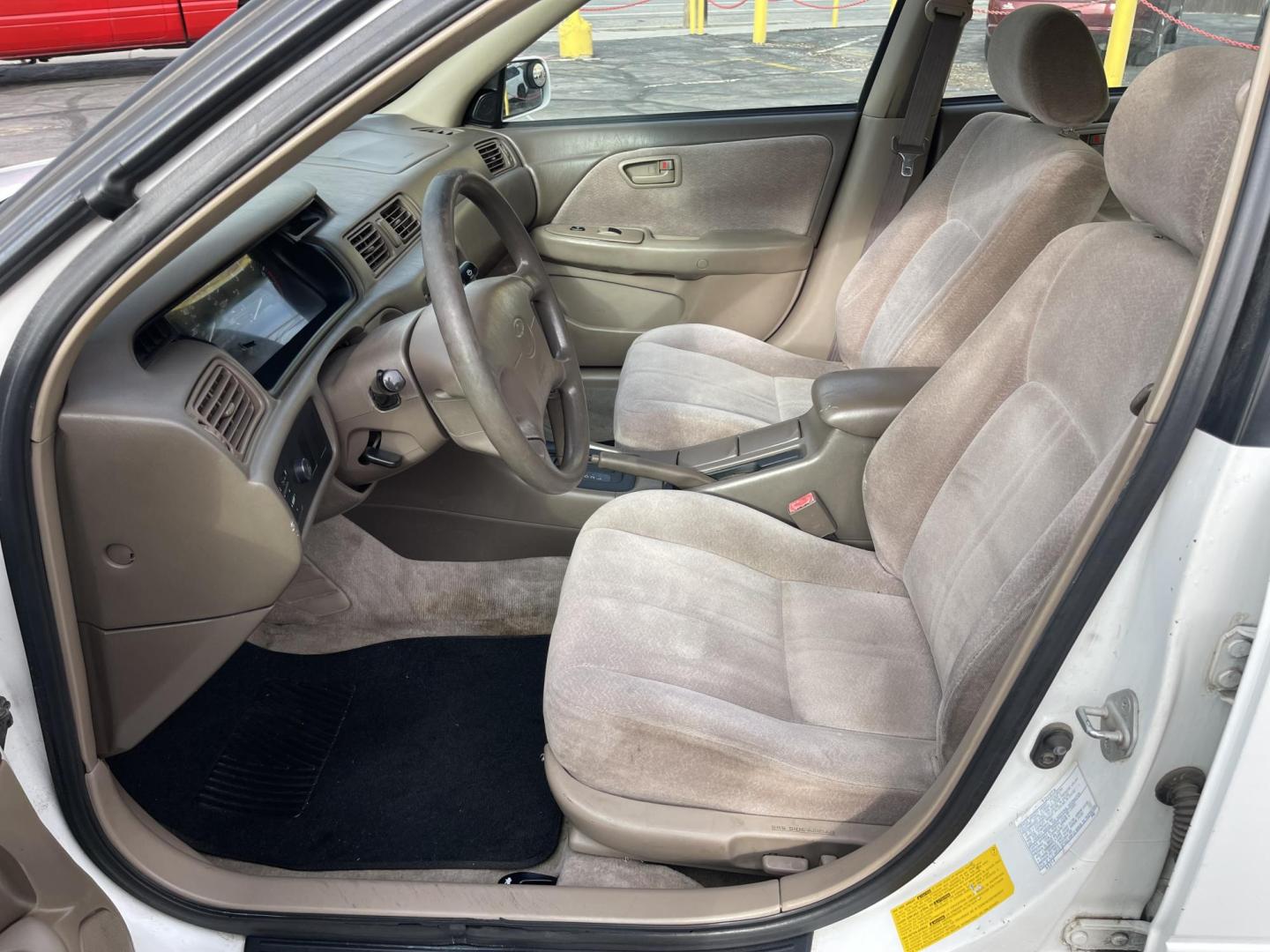 1999 Pure White /Tan Toyota Camry LE (JT2BG28KXX0) with an 2.2Liter 4 Cylinder engine, Automatic transmission, located at 801 South State Street, Salt Lake City, UT, 84111, (801) 328-0098, 40.751953, -111.888206 - Top Features:Cloth Seats, ABS Brakes, CD Audio, Power Mirrors, Side Airbags, AM/FM Stereo, Cassette Player, Power Seat(s), Air Conditioning, Cruise Control, Power Windows, Automatic Transmission, Power Locks, Rear Defroster "Experience unbeatable reliability with this 1999 used Toyota Camry. Boasti - Photo#11