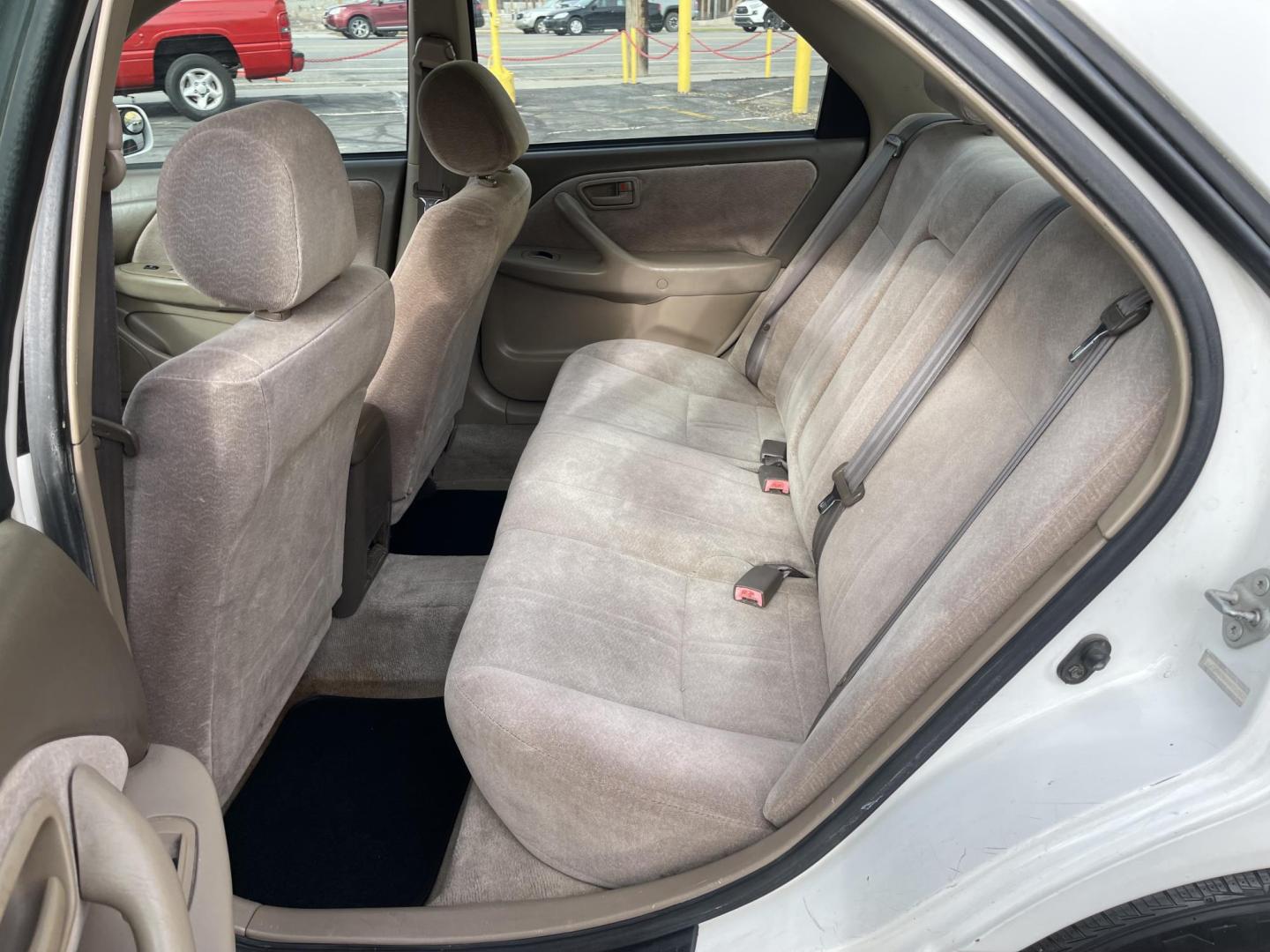 1999 Pure White /Tan Toyota Camry LE (JT2BG28KXX0) with an 2.2Liter 4 Cylinder engine, Automatic transmission, located at 801 South State Street, Salt Lake City, UT, 84111, (801) 328-0098, 40.751953, -111.888206 - Top Features:Cloth Seats, ABS Brakes, CD Audio, Power Mirrors, Side Airbags, AM/FM Stereo, Cassette Player, Power Seat(s), Air Conditioning, Cruise Control, Power Windows, Automatic Transmission, Power Locks, Rear Defroster "Experience unbeatable reliability with this 1999 used Toyota Camry. Boasti - Photo#12