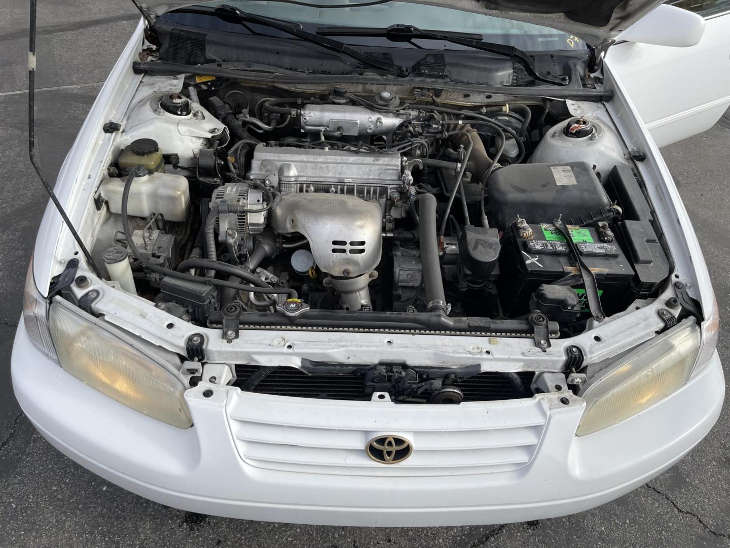 1999 Pure White /Tan Toyota Camry LE (JT2BG28KXX0) with an 2.2Liter 4 Cylinder engine, Automatic transmission, located at 801 South State Street, Salt Lake City, UT, 84111, (801) 328-0098, 40.751953, -111.888206 - Top Features:Cloth Seats, ABS Brakes, CD Audio, Power Mirrors, Side Airbags, AM/FM Stereo, Cassette Player, Power Seat(s), Air Conditioning, Cruise Control, Power Windows, Automatic Transmission, Power Locks, Rear Defroster "Experience unbeatable reliability with this 1999 used Toyota Camry. Boasti - Photo#19