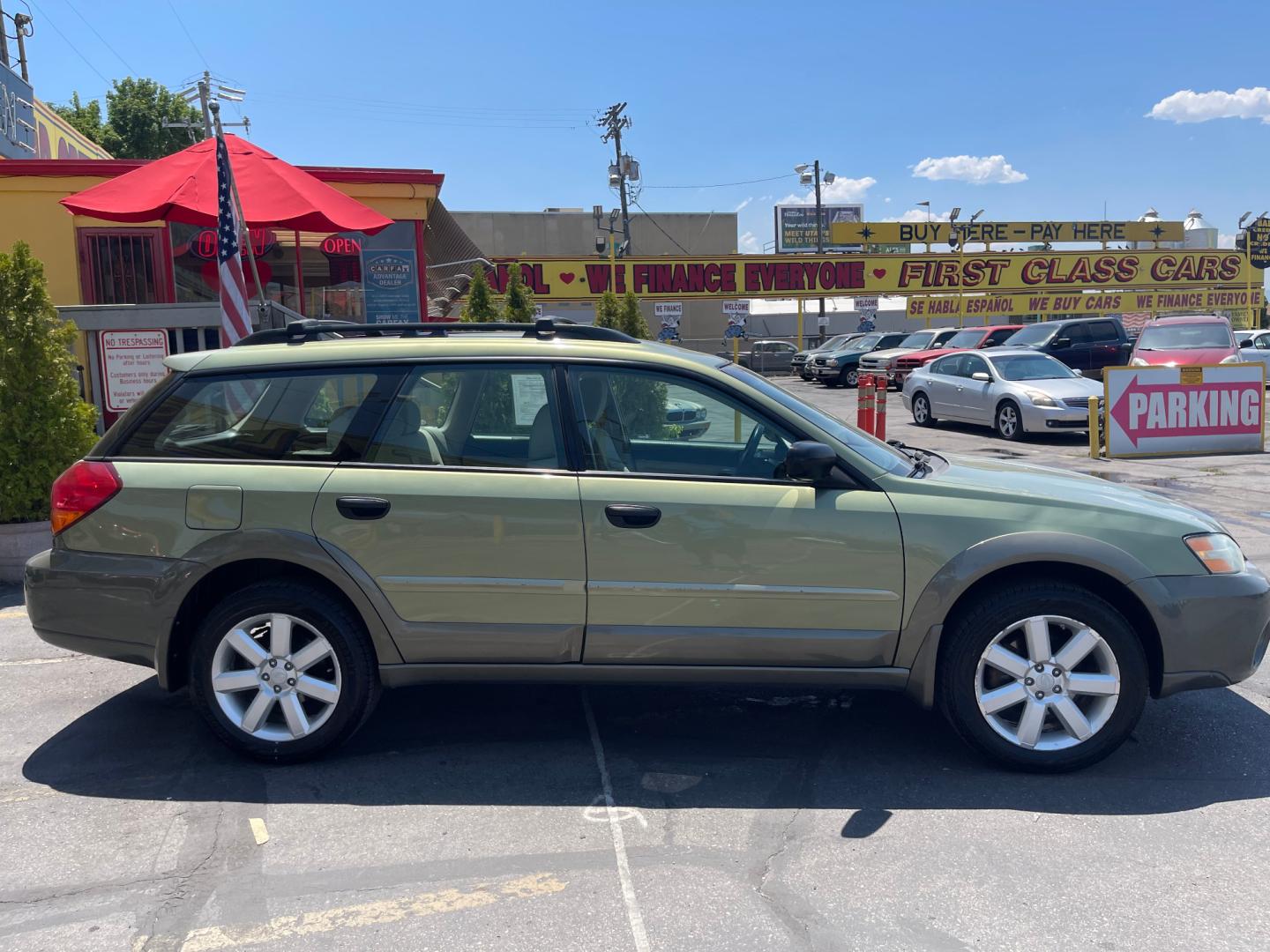 2007 Evergreen Frost Metallic /Tan Subaru Outback Crossover Wagon (4S4BP61CX77) with an 2.5L H4 engine, Automatic transmission, located at 801 South State Street, Salt Lake City, UT, 84111, (801) 328-0098, 40.751953, -111.888206 - Features: 4WD/AWD, Alloy Wheels, Cloth Seats, Front Seat Heaters, ABS Brakes, Auxiliary Audio Input, Overhead Airbags, Rear Defroster, AM/FM Stereo, CD Audio, Power Locks, Side Airbags, Air Conditioning, Cruise Control, Power Mirrors, Automatic Transmission, Full Roof Rack, Power Windows. - Photo#5