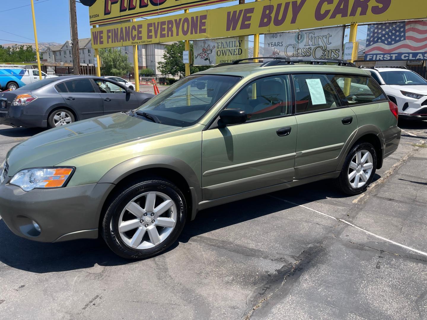 2007 Evergreen Frost Metallic /Tan Subaru Outback Crossover Wagon (4S4BP61CX77) with an 2.5L H4 engine, Automatic transmission, located at 801 South State Street, Salt Lake City, UT, 84111, (801) 328-0098, 40.751953, -111.888206 - Features: 4WD/AWD, Alloy Wheels, Cloth Seats, Front Seat Heaters, ABS Brakes, Auxiliary Audio Input, Overhead Airbags, Rear Defroster, AM/FM Stereo, CD Audio, Power Locks, Side Airbags, Air Conditioning, Cruise Control, Power Mirrors, Automatic Transmission, Full Roof Rack, Power Windows. - Photo#12