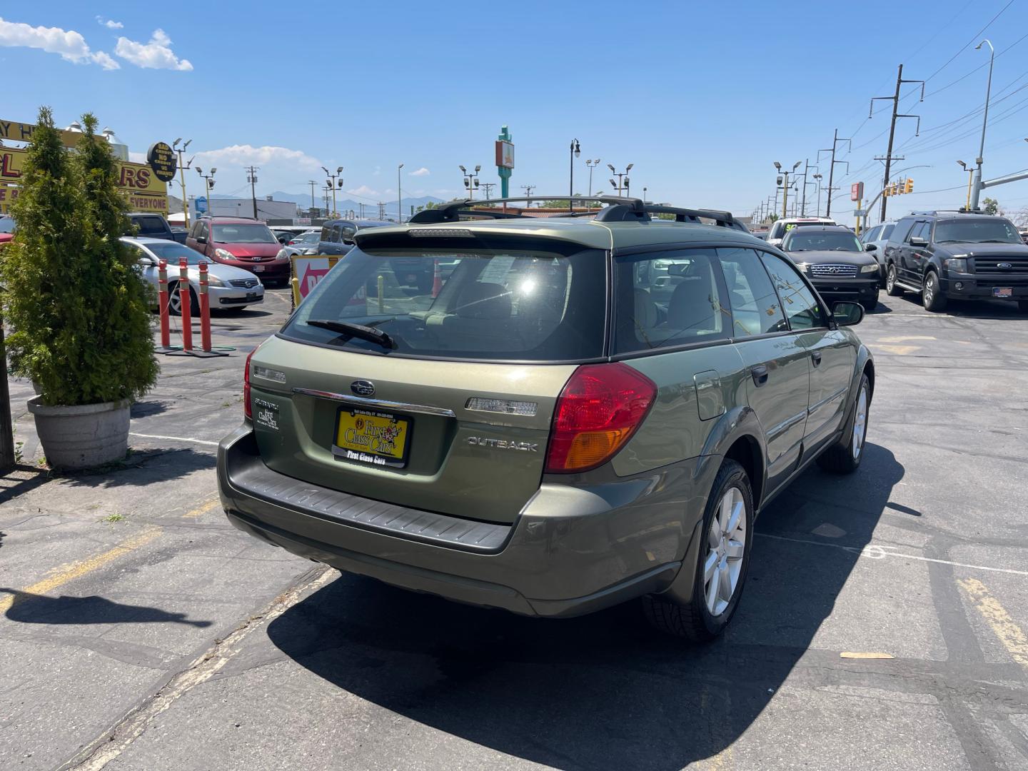 2007 Evergreen Frost Metallic /Tan Subaru Outback Crossover Wagon (4S4BP61CX77) with an 2.5L H4 engine, Automatic transmission, located at 801 South State Street, Salt Lake City, UT, 84111, (801) 328-0098, 40.751953, -111.888206 - Features: 4WD/AWD, Alloy Wheels, Cloth Seats, Front Seat Heaters, ABS Brakes, Auxiliary Audio Input, Overhead Airbags, Rear Defroster, AM/FM Stereo, CD Audio, Power Locks, Side Airbags, Air Conditioning, Cruise Control, Power Mirrors, Automatic Transmission, Full Roof Rack, Power Windows. - Photo#7