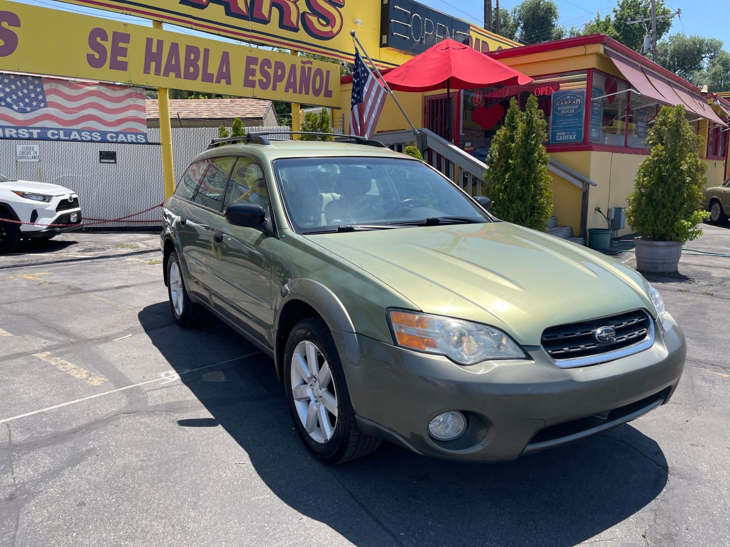2007 Evergreen Frost Metallic /Tan Subaru Outback Crossover Wagon (4S4BP61CX77) with an 2.5L H4 engine, Automatic transmission, located at 801 South State Street, Salt Lake City, UT, 84111, (801) 328-0098, 40.751953, -111.888206 - Features: 4WD/AWD, Alloy Wheels, Cloth Seats, Front Seat Heaters, ABS Brakes, Auxiliary Audio Input, Overhead Airbags, Rear Defroster, AM/FM Stereo, CD Audio, Power Locks, Side Airbags, Air Conditioning, Cruise Control, Power Mirrors, Automatic Transmission, Full Roof Rack, Power Windows. - Photo#3